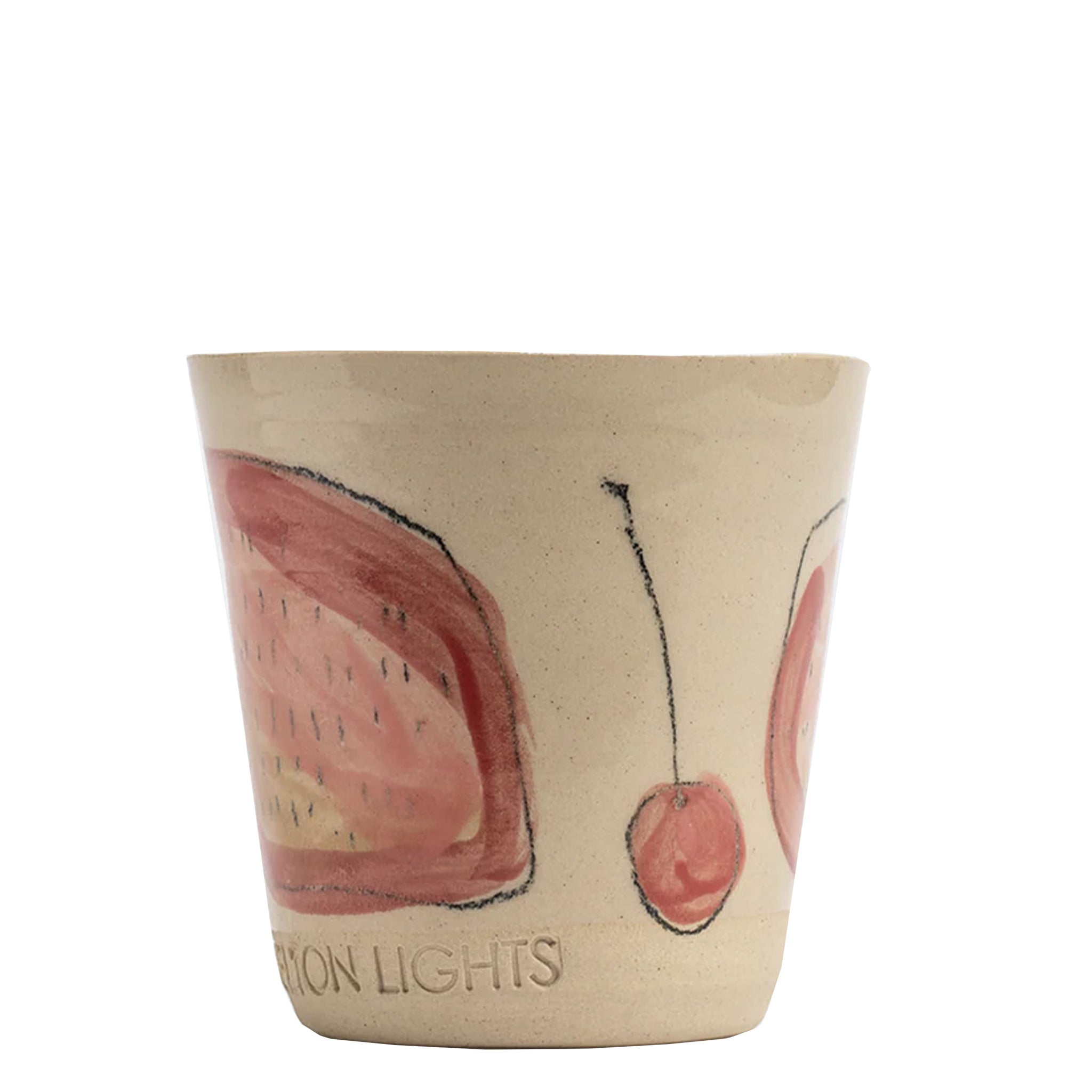 Ceramic cup with cherry design and 'Moon Lights' text on a beige background