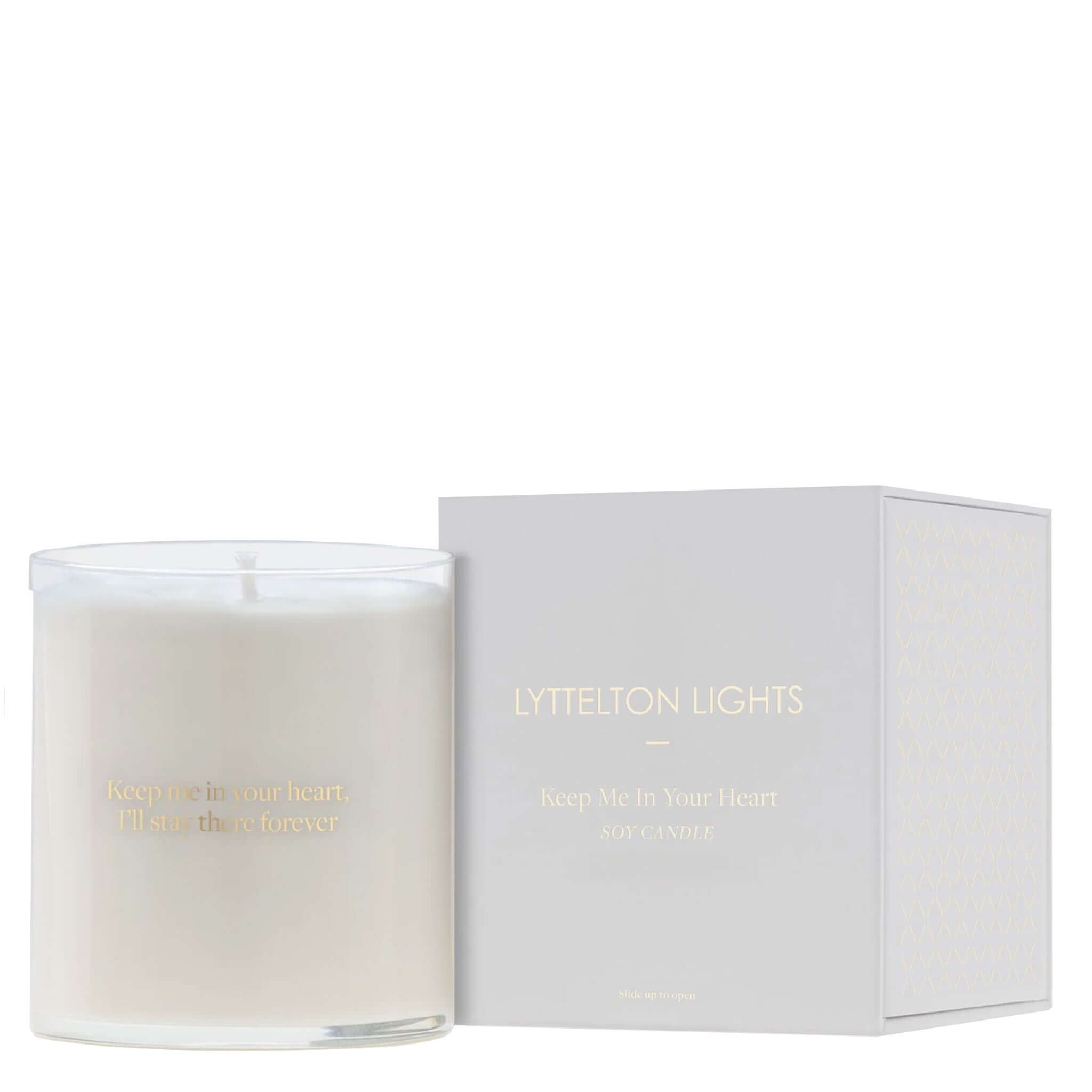 Candle with 'LYTTELTON LIGHTS' branding on a white background