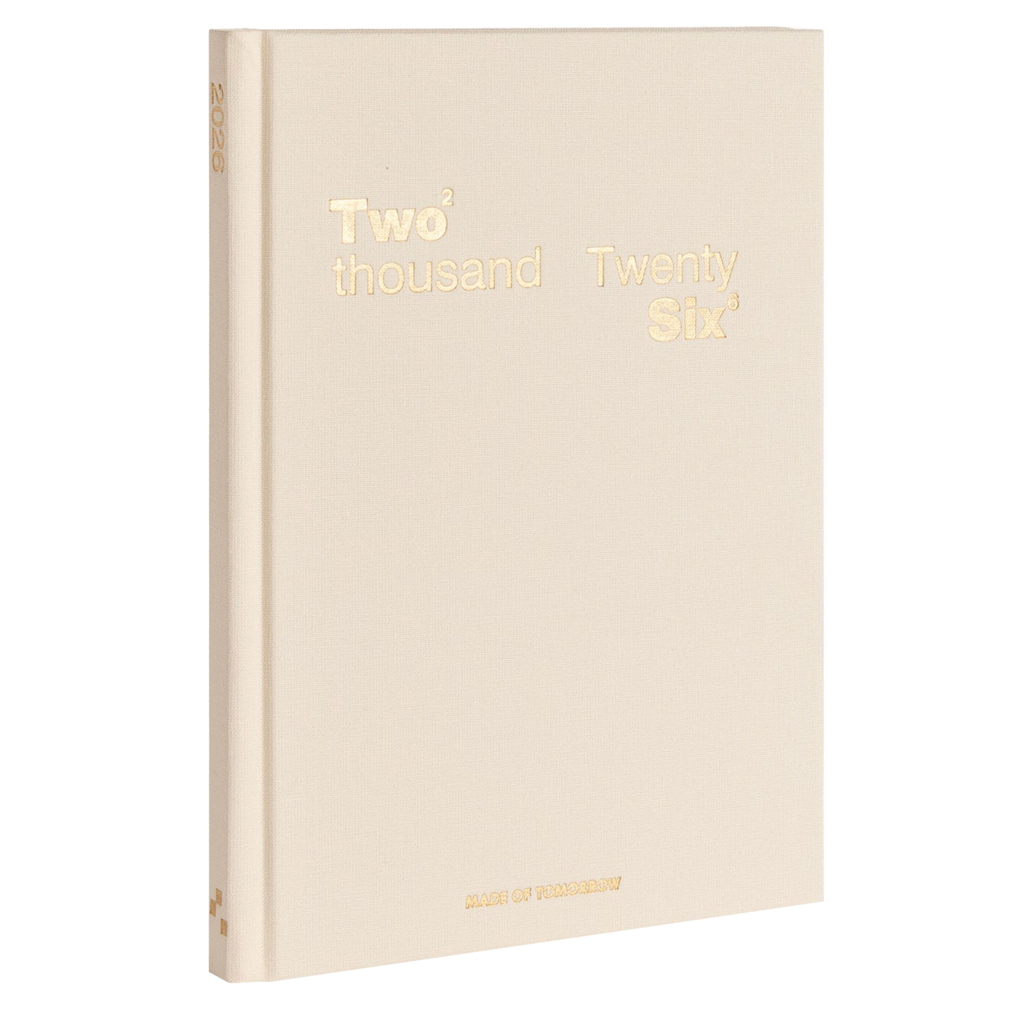Beige notebook with 'Two Thousand Twenty Six' printed in gold on a white background