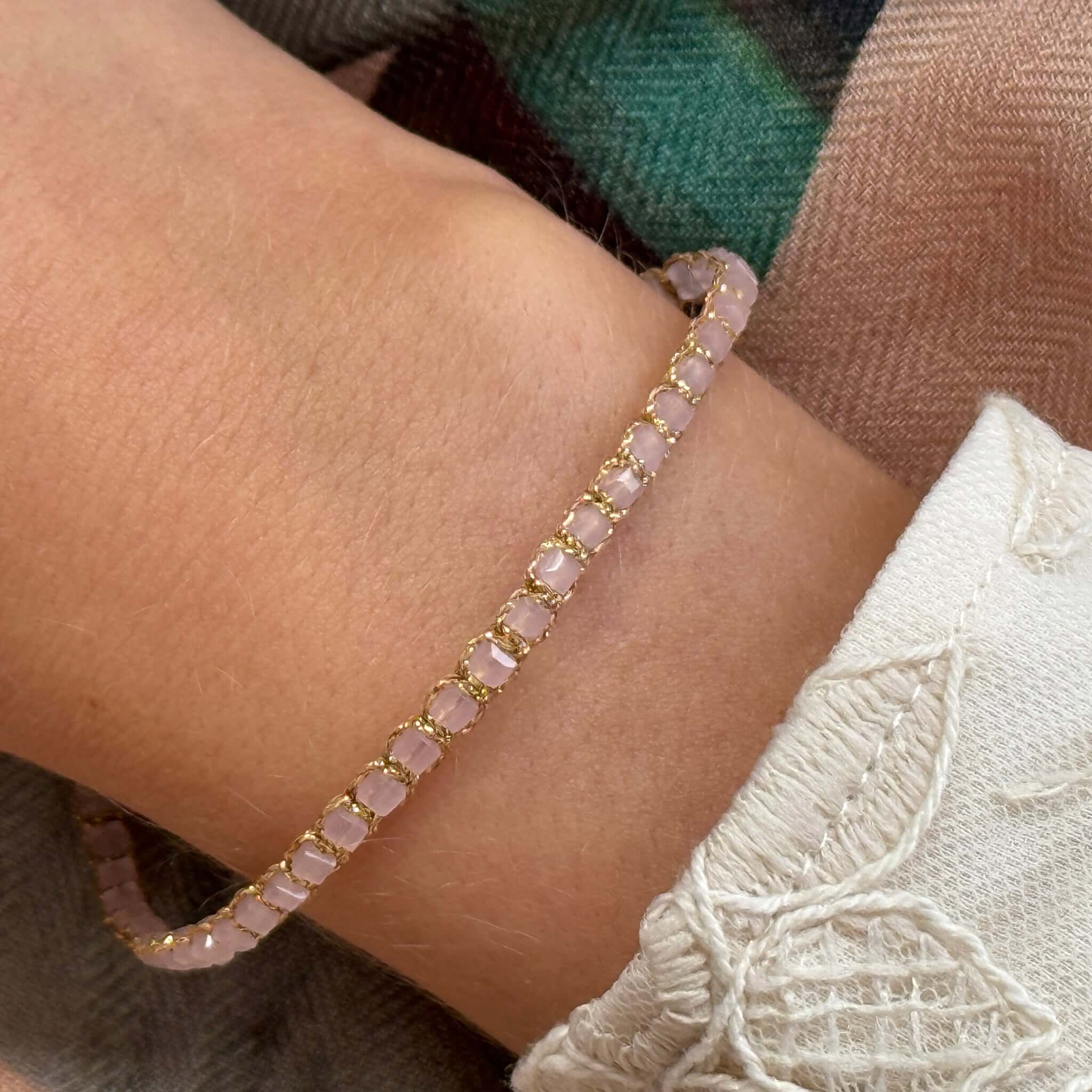 Margaret Adeline Bracelet featuring delicate faceted crystals on a fine gold cord, beautifully catching the light.