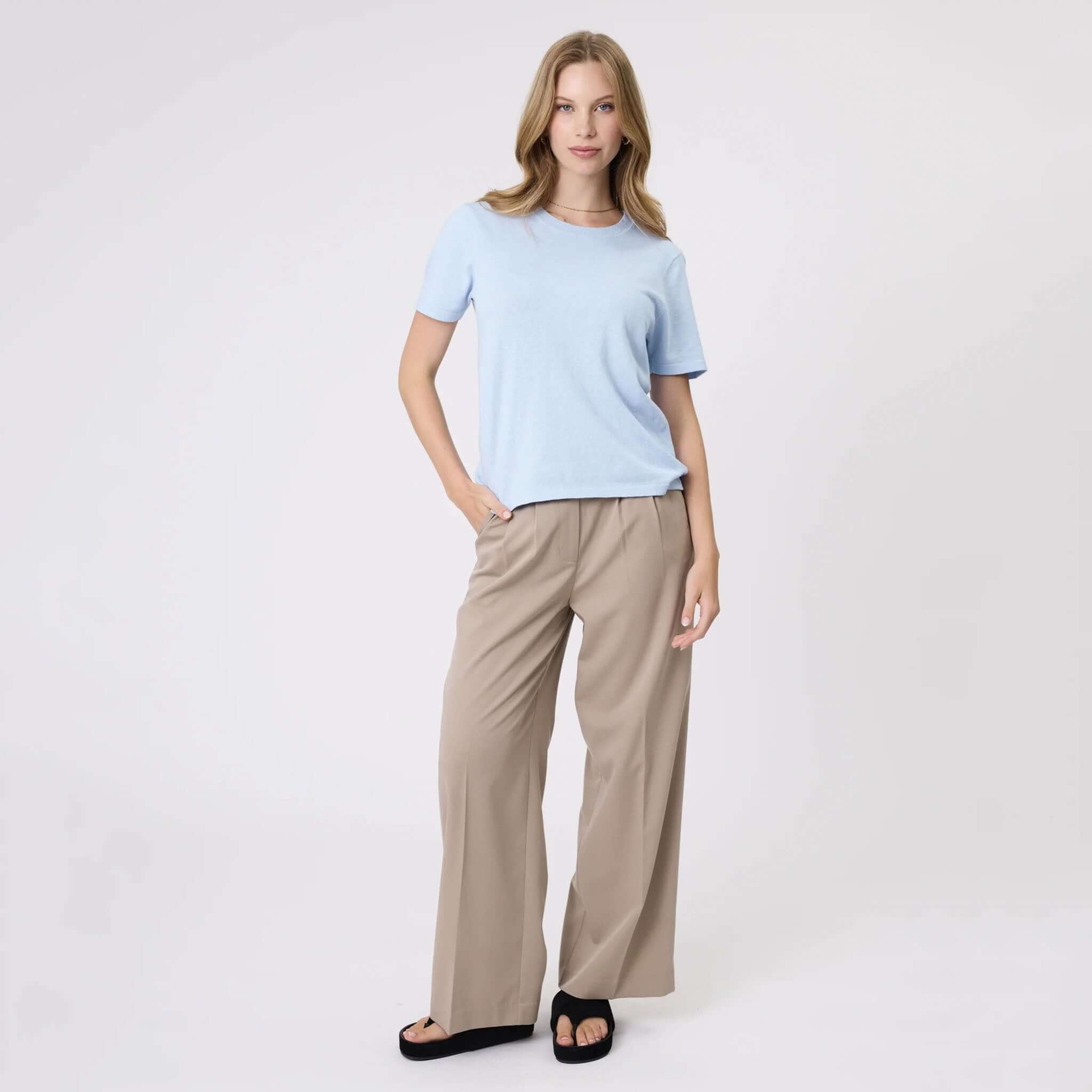Marlow Mode Pants - Ecru wide leg full-length pants with front pleats, elastic back and side pockets, styled on model