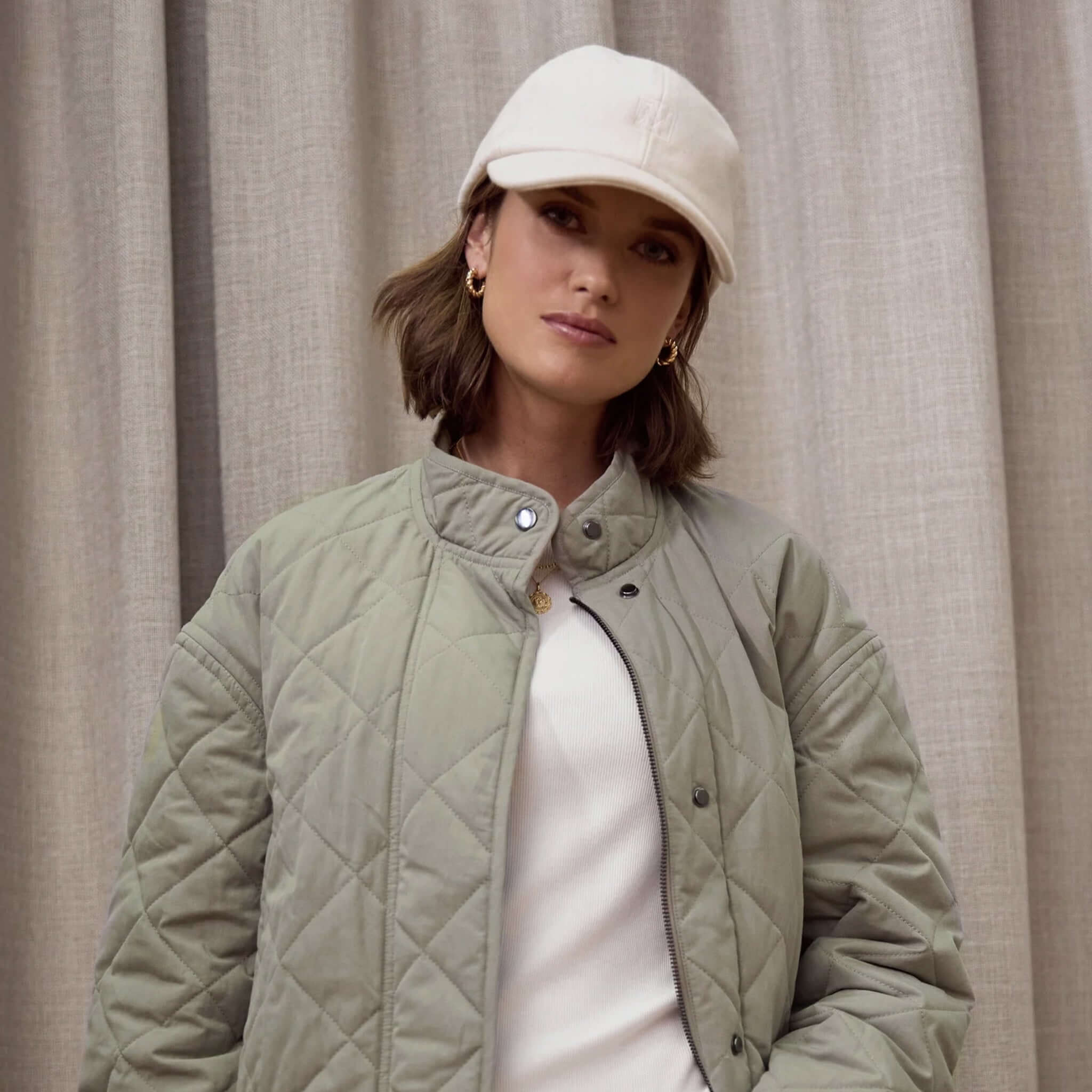 Alt Tag: Marlow Wool Cap in ivory wool blend, classic 6-panel women’s cap with adjustable back strap and breathable eyelets