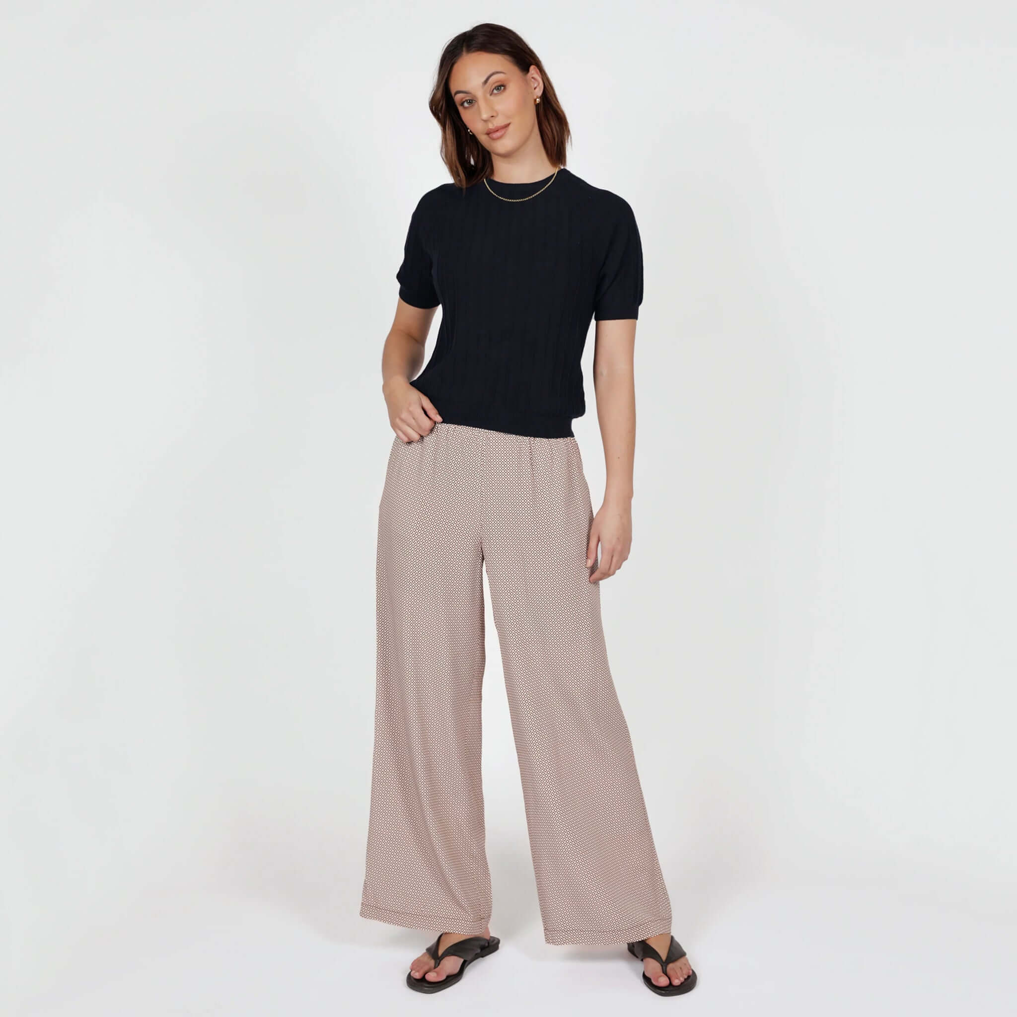Model wearing Marlow Eclipse Wide Leg Pants - Prism with a navy top, showcasing the stylish wide-leg design.
