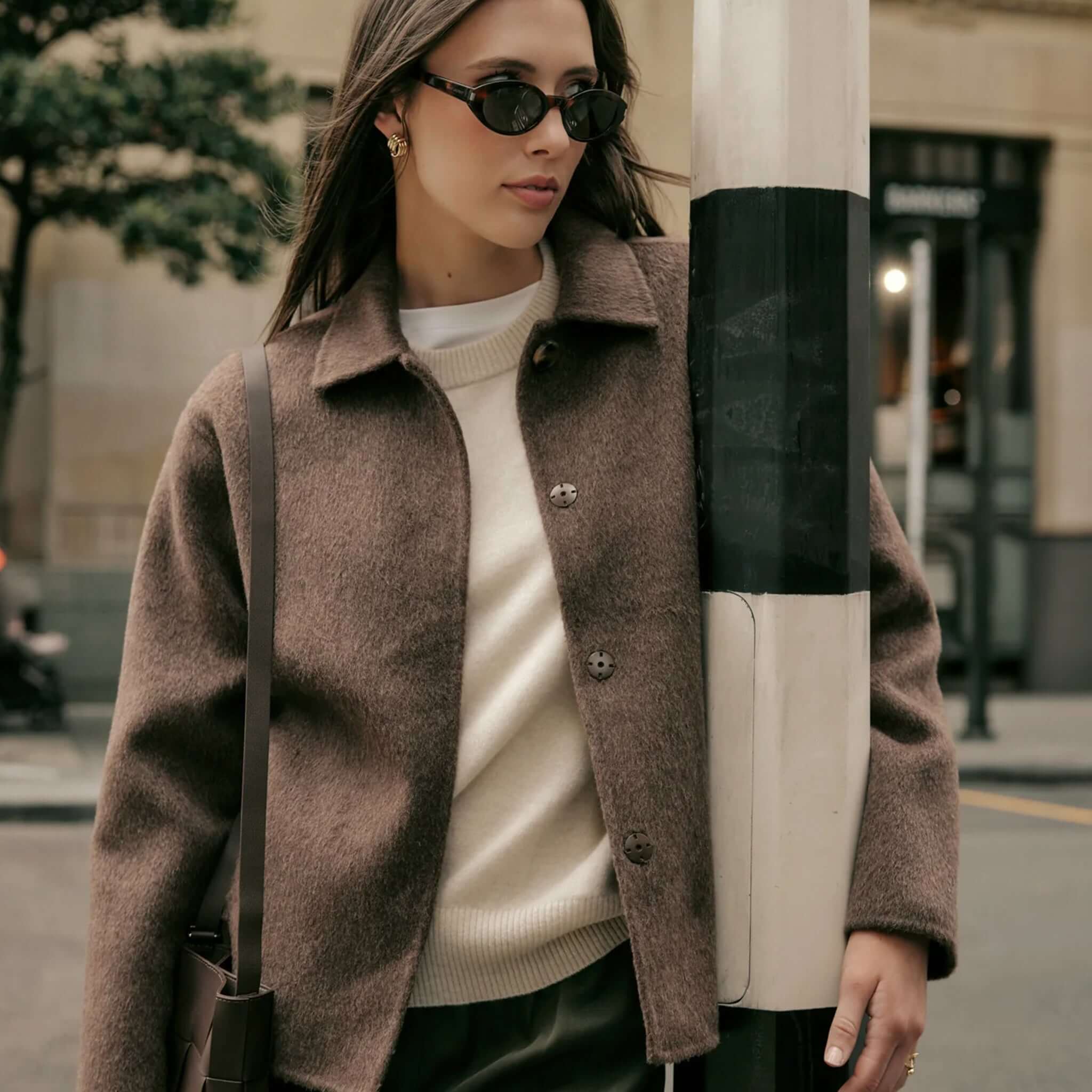 Marlow Loft Wool Coat - Mushroom worn by a stylish woman, showcasing a premium wool finish and structured silhouette.