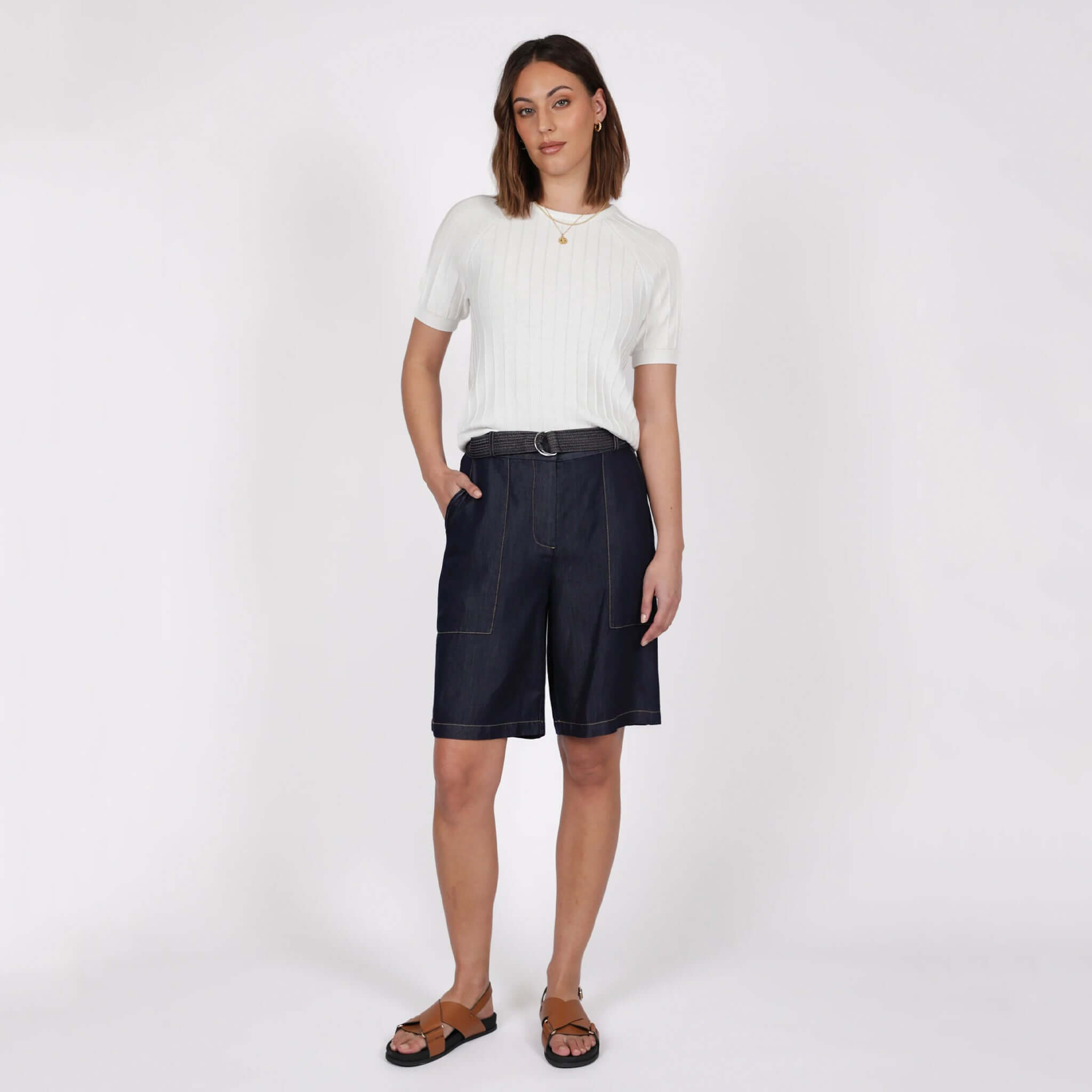Marlow Soleil Knit Tee - Ivory worn with navy shorts and sandals against a neutral background.