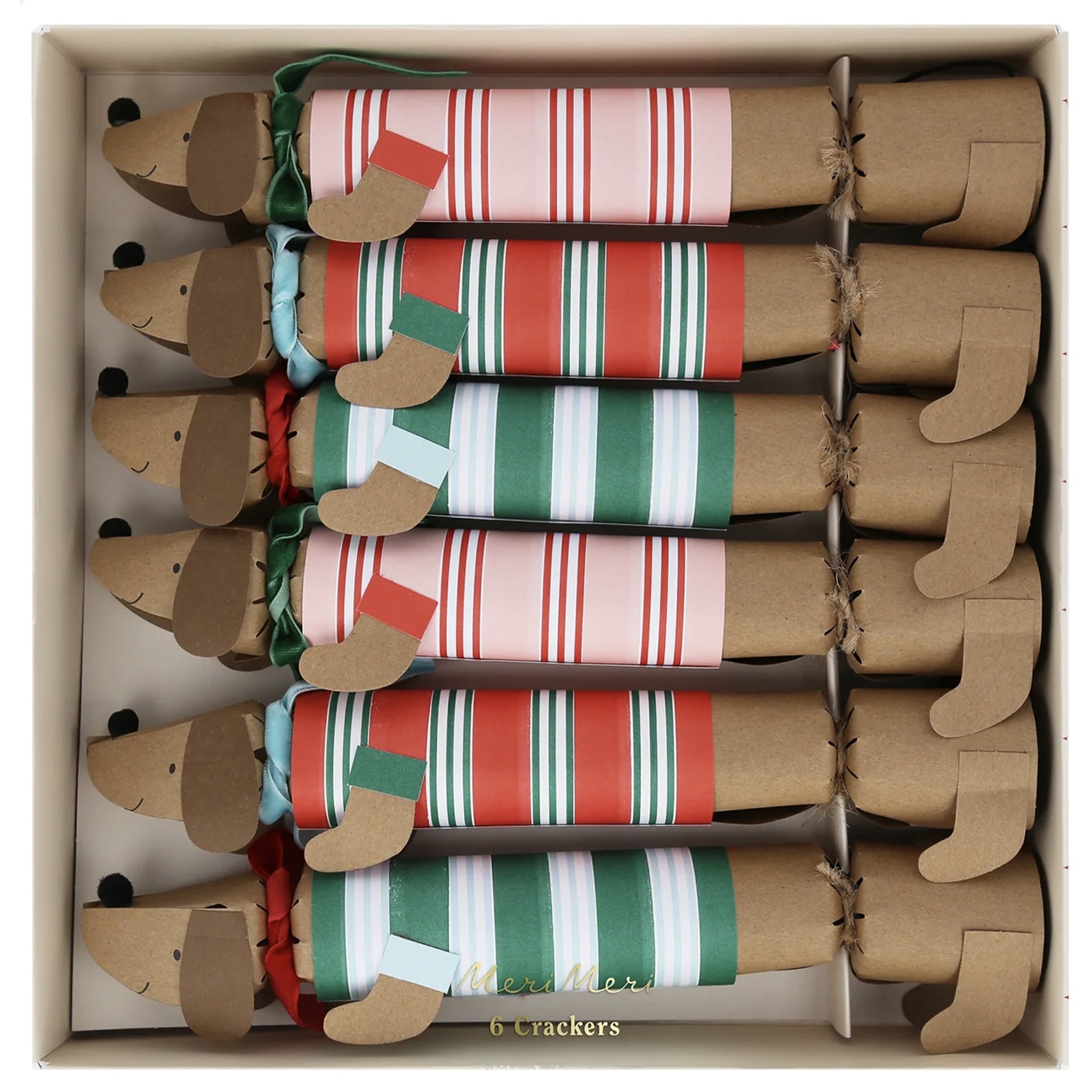 Box of Christmas crackers shaped like dogs with striped patterns.