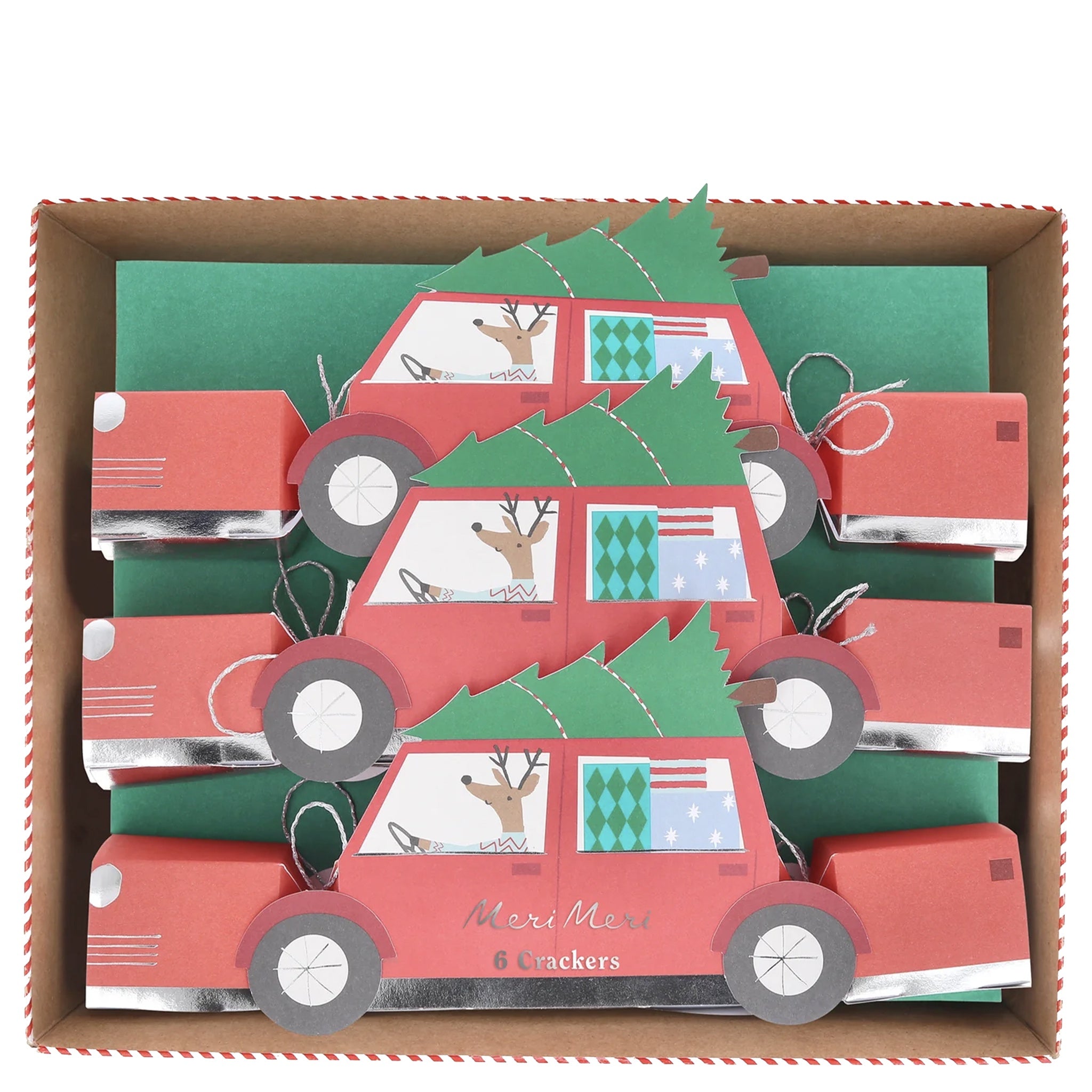 Red car-shaped crackers with green trees and festive designs in a box