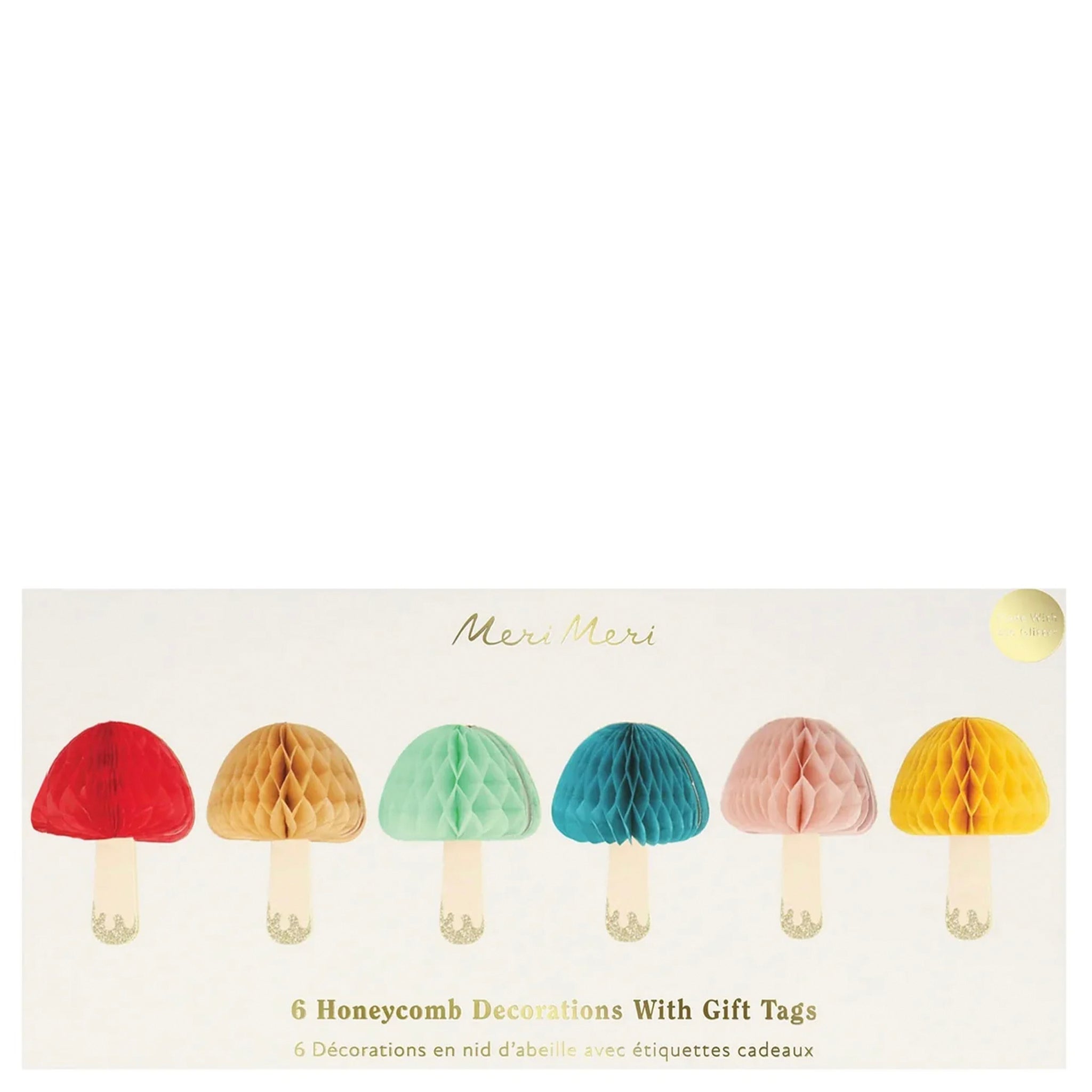 Packaging of honeycomb mushroom decorations with gift tags on a white background