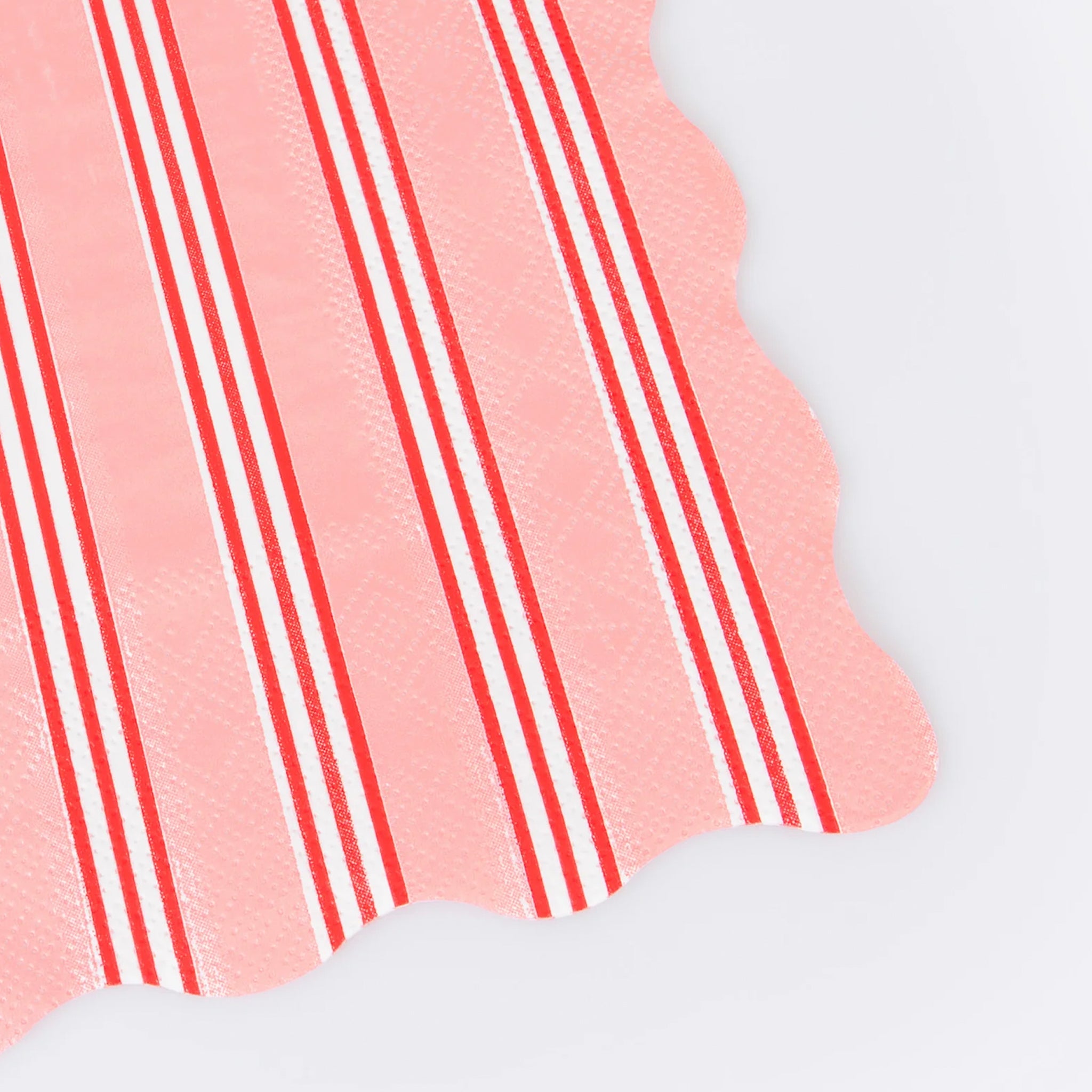 Close-up of a pink paper napkin on a white background