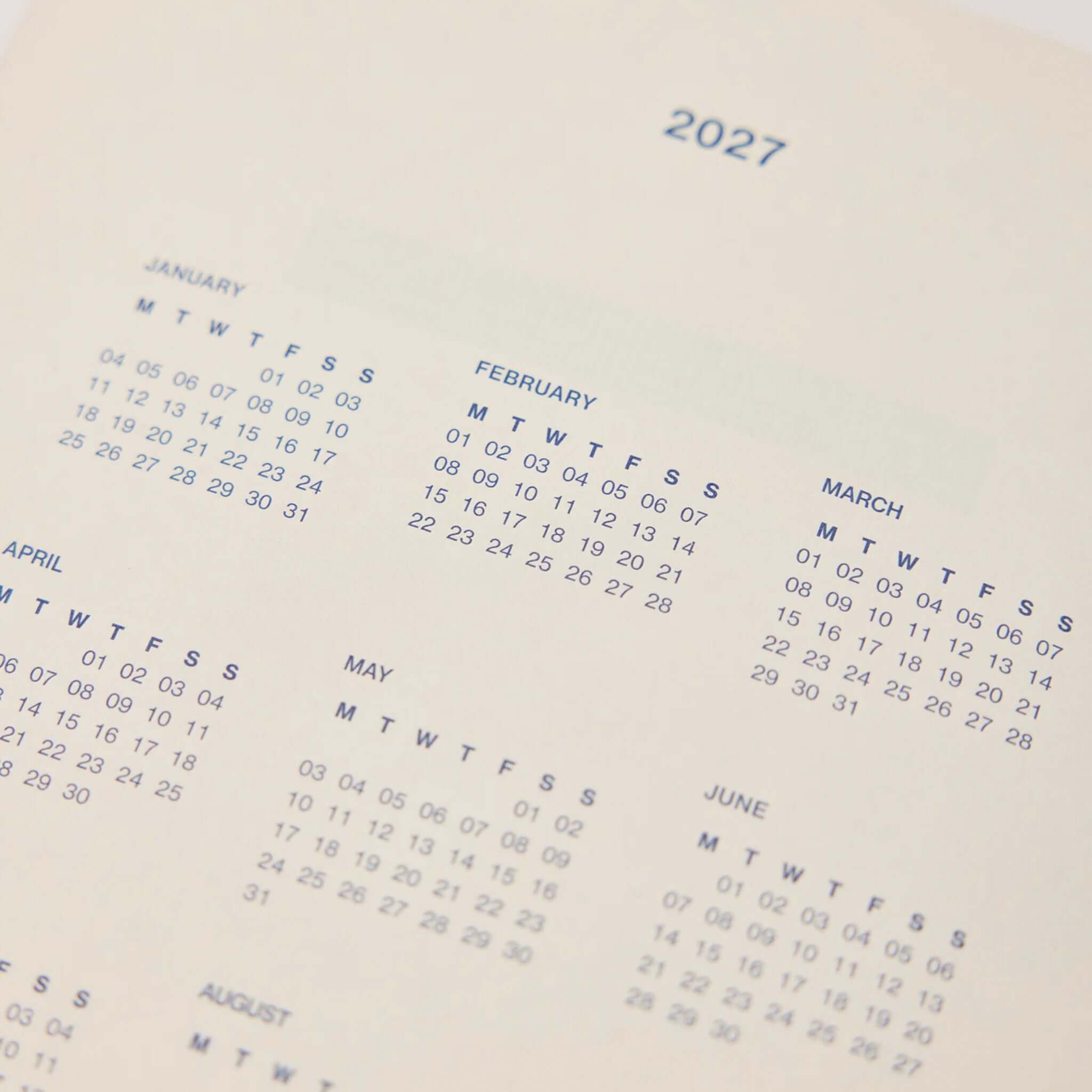 Milligram Any Day Now 2027 Weekly Achiever - Pink & Navy calendar layout for 2027 monthly overview.