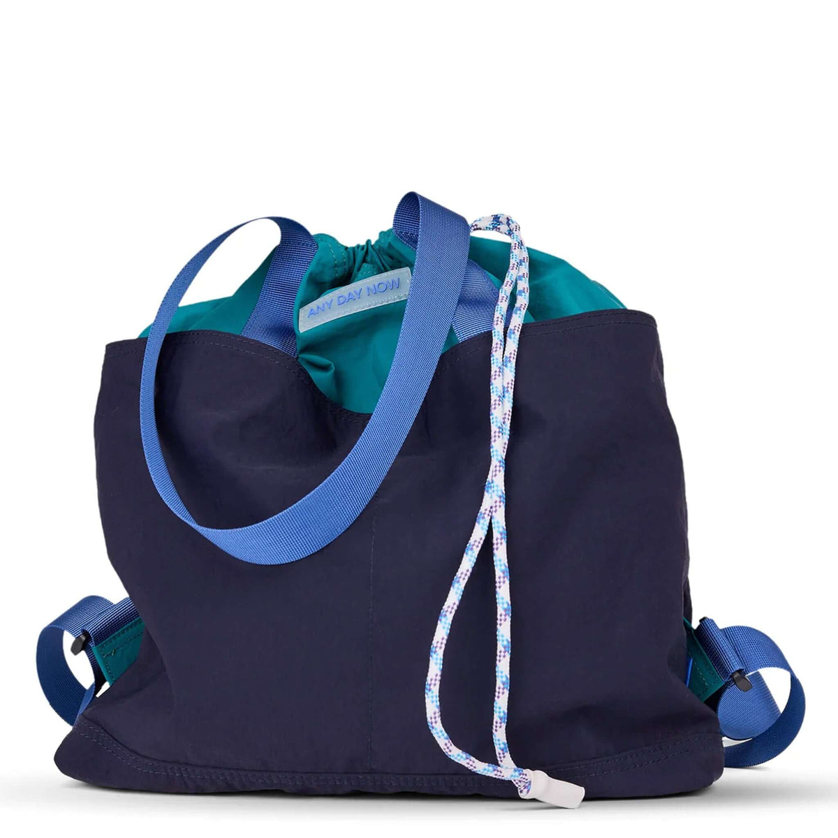 Milligram Any Day Now Any Day Backpack - Navy & Blue with blue webbing and drawstring closure.