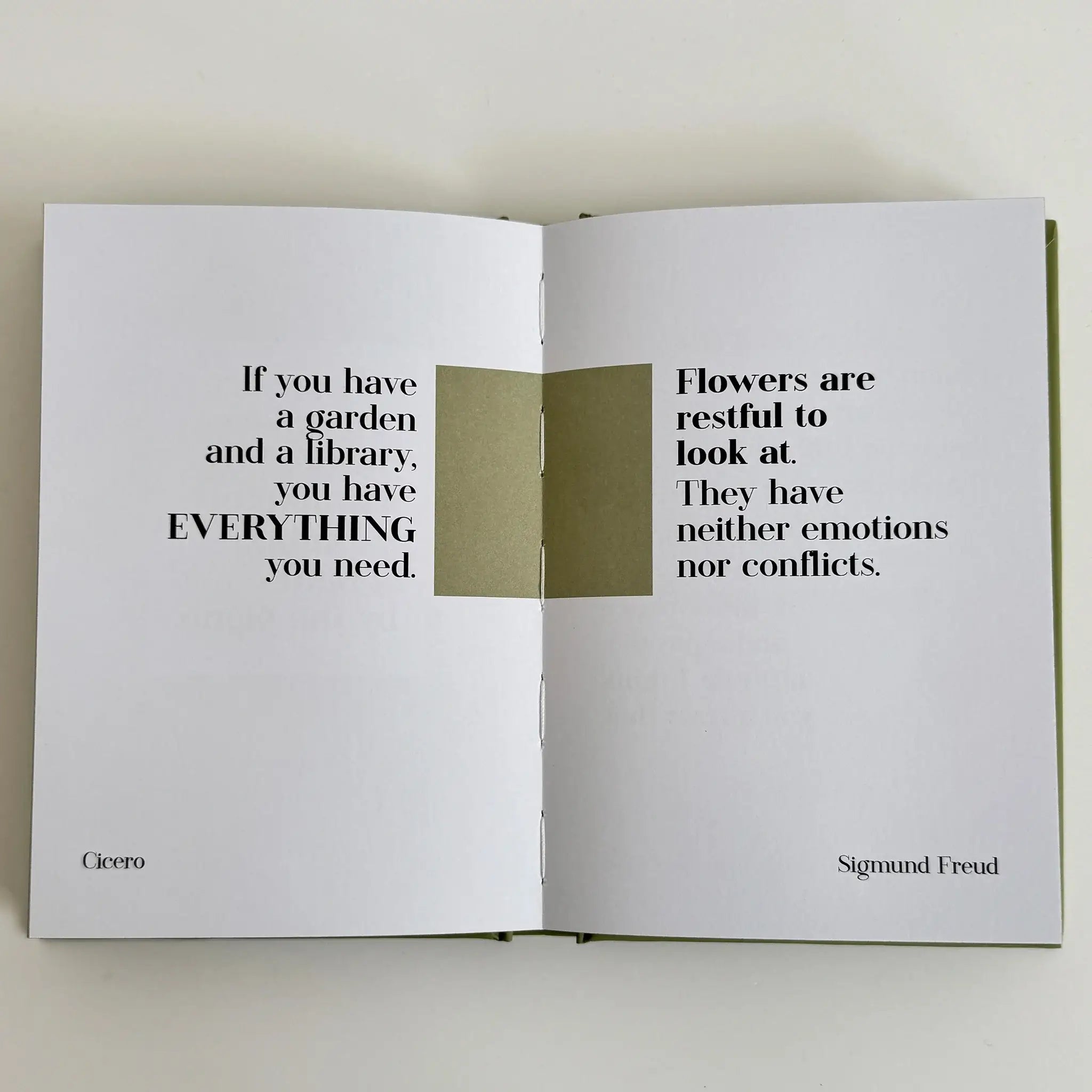 Alt Tag: Modern Quotable - Find your Calm hardcover mindful quote book open to calming page spread with garden and flowers quotes