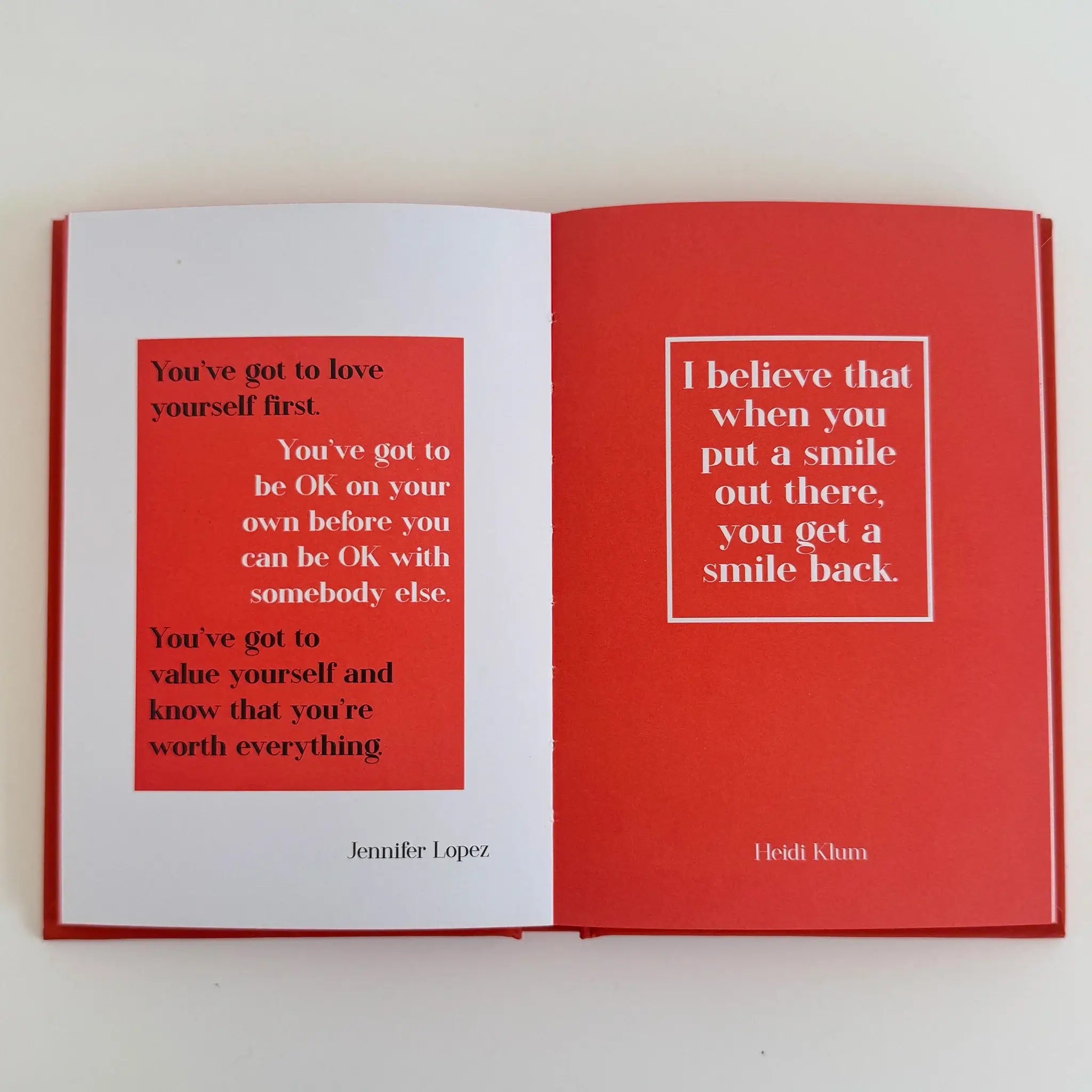 Alt Tag: Modern Quotable - You are Awesome open hardcover book with red pages featuring uplifting quotes and affirmations spread