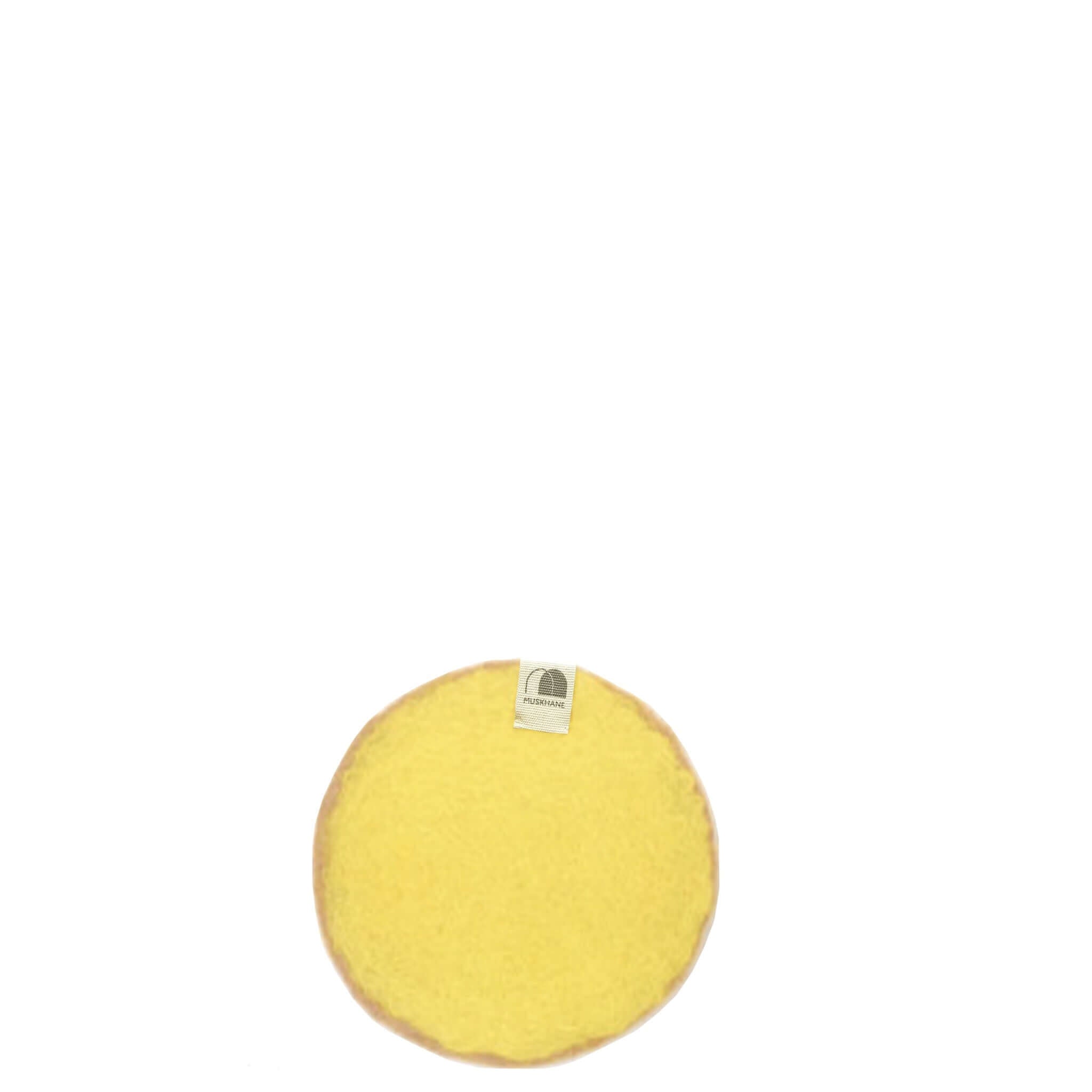 Muskhane Felt Two Tone Round Coaster - Nude & Lemon with a yellow felt surface and soft edges.