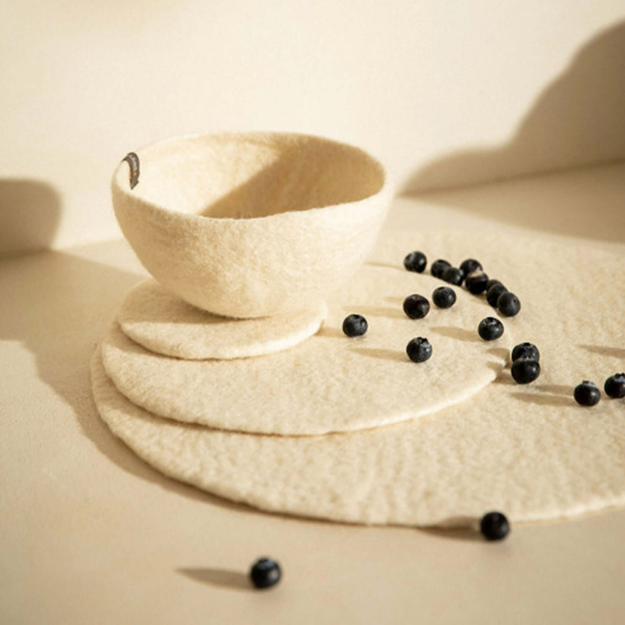 Alt Tag: Muskhane Felt Plain Round Coaster - Natural felt round coasters with matching felt bowl, handmade in Nepal, 12cm