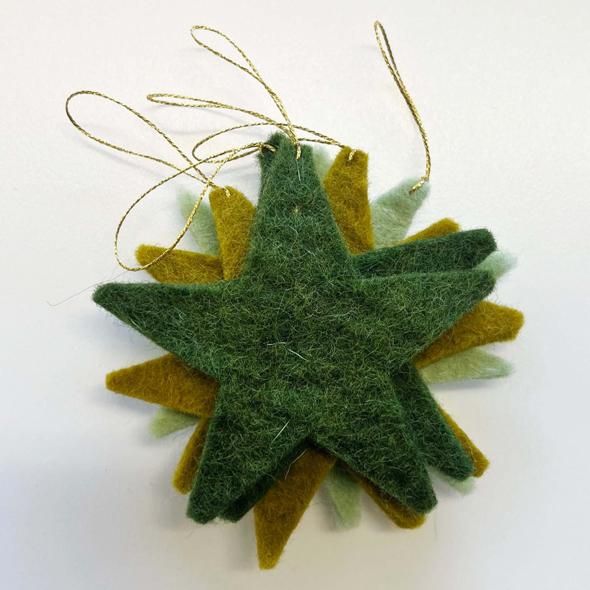 Alt Tag: Muskhane Felt Festive Star Set - Harmony Mint wool felt star ornaments with hanging loops for Christmas tree decor