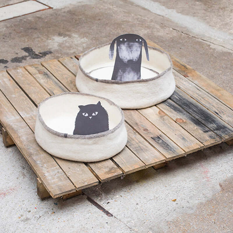 Alt Tag: Muskhane Felt Dog Basket - Mangrove wool felt pet bed on wooden pallet, low round basket for small dogs and cats