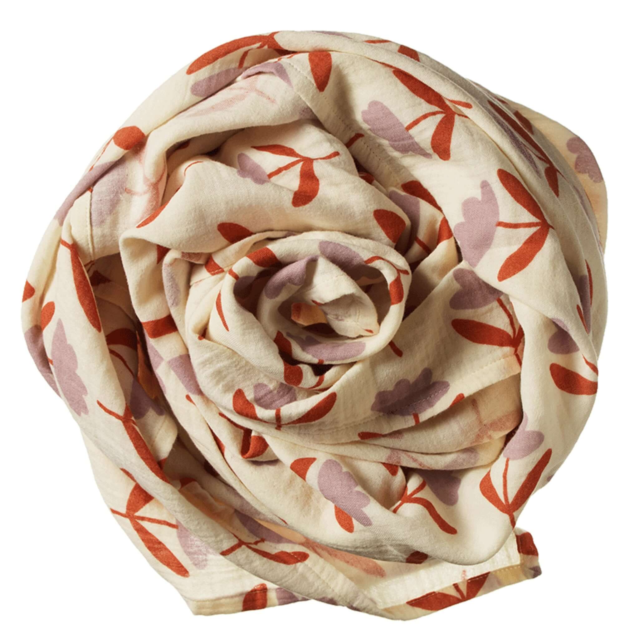 Nature Baby Organic Cotton Muslin Wrap - Fleurette rolled in a floral print design, perfect for swaddling and lounging.