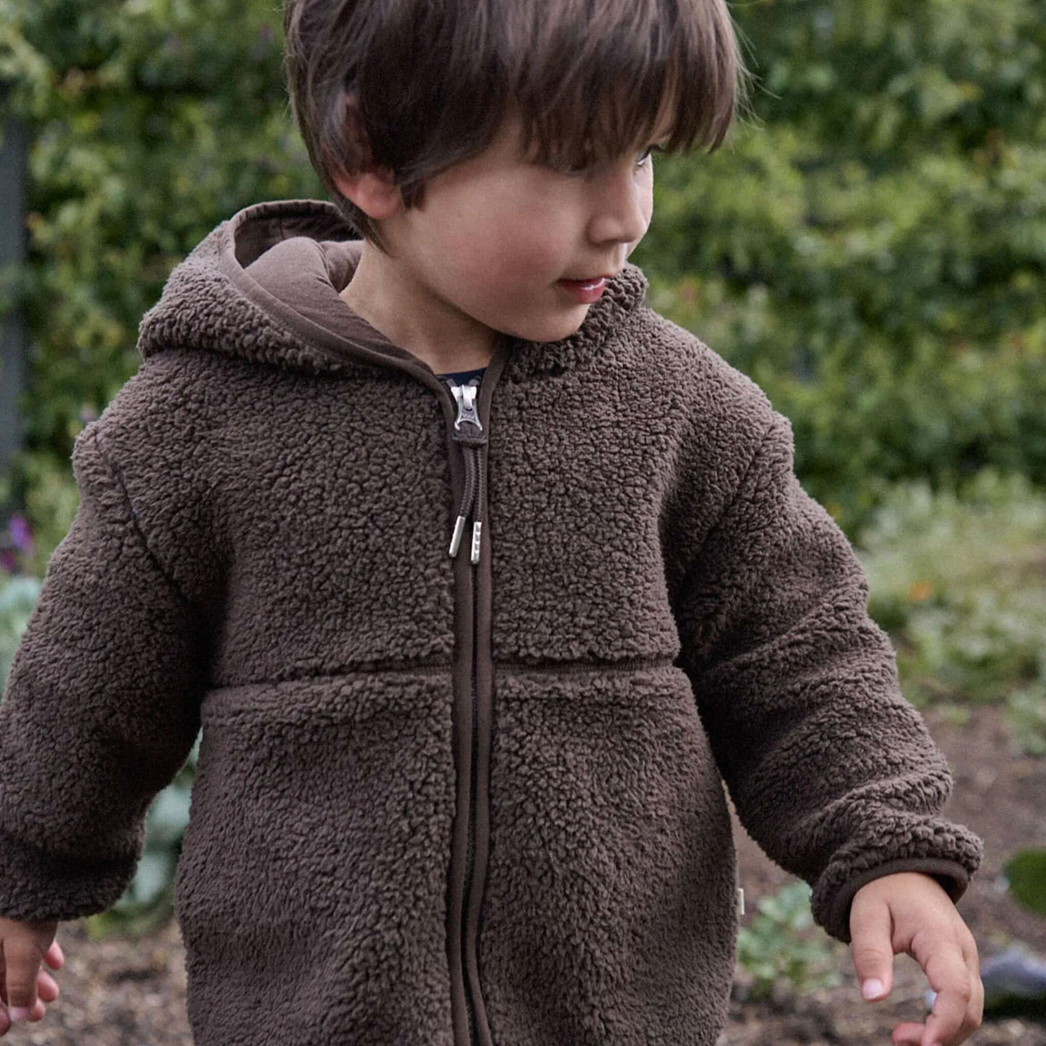 Nature Baby Field Jacket - Pinecone on child outdoors, recycled polyester jacket with hood, YKK zip and pockets for cooler days