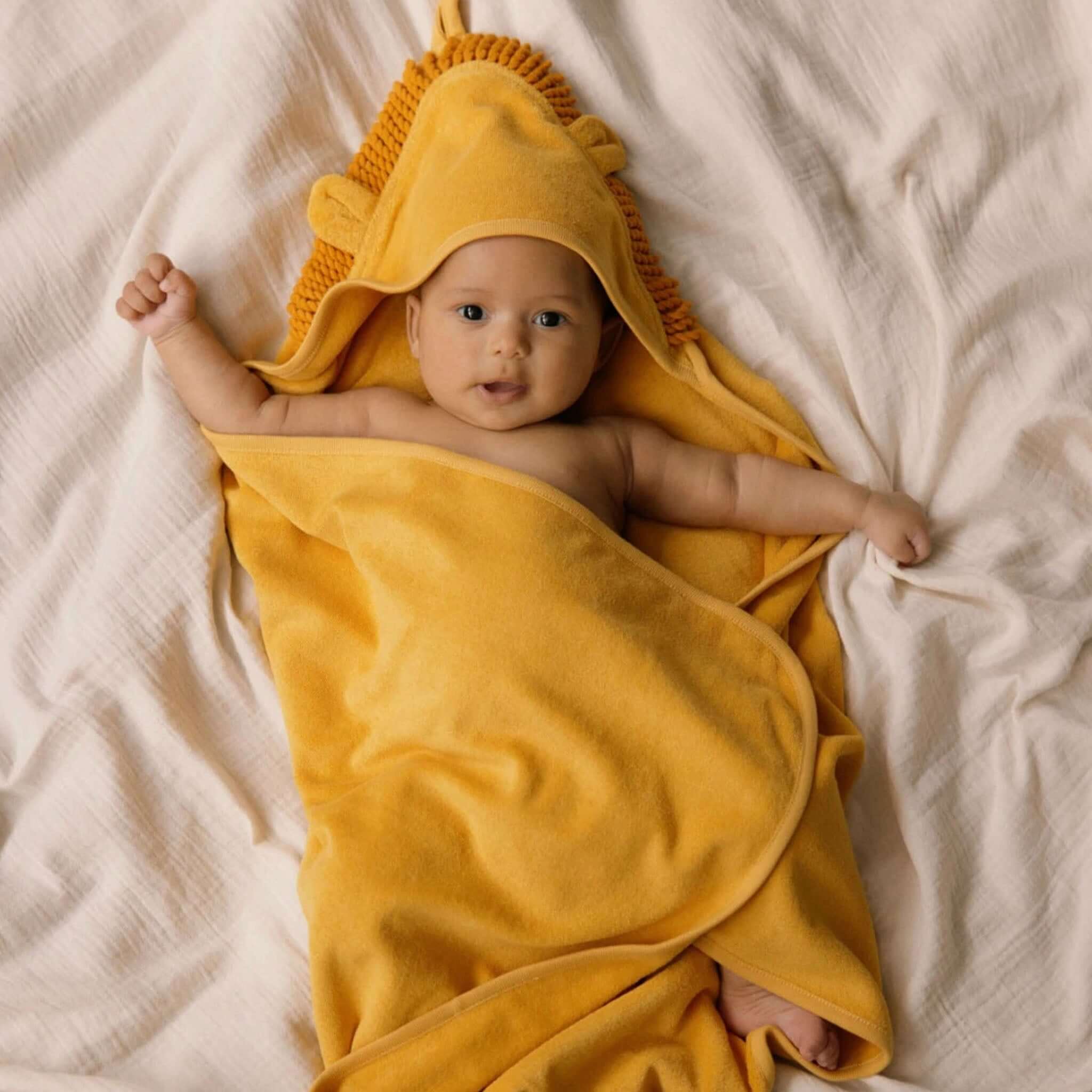 Alt Tag: Nature Baby Organic Cotton Lion Hooded Towel - Golden on baby, super soft GOTS organic cotton terry hood with lion ears