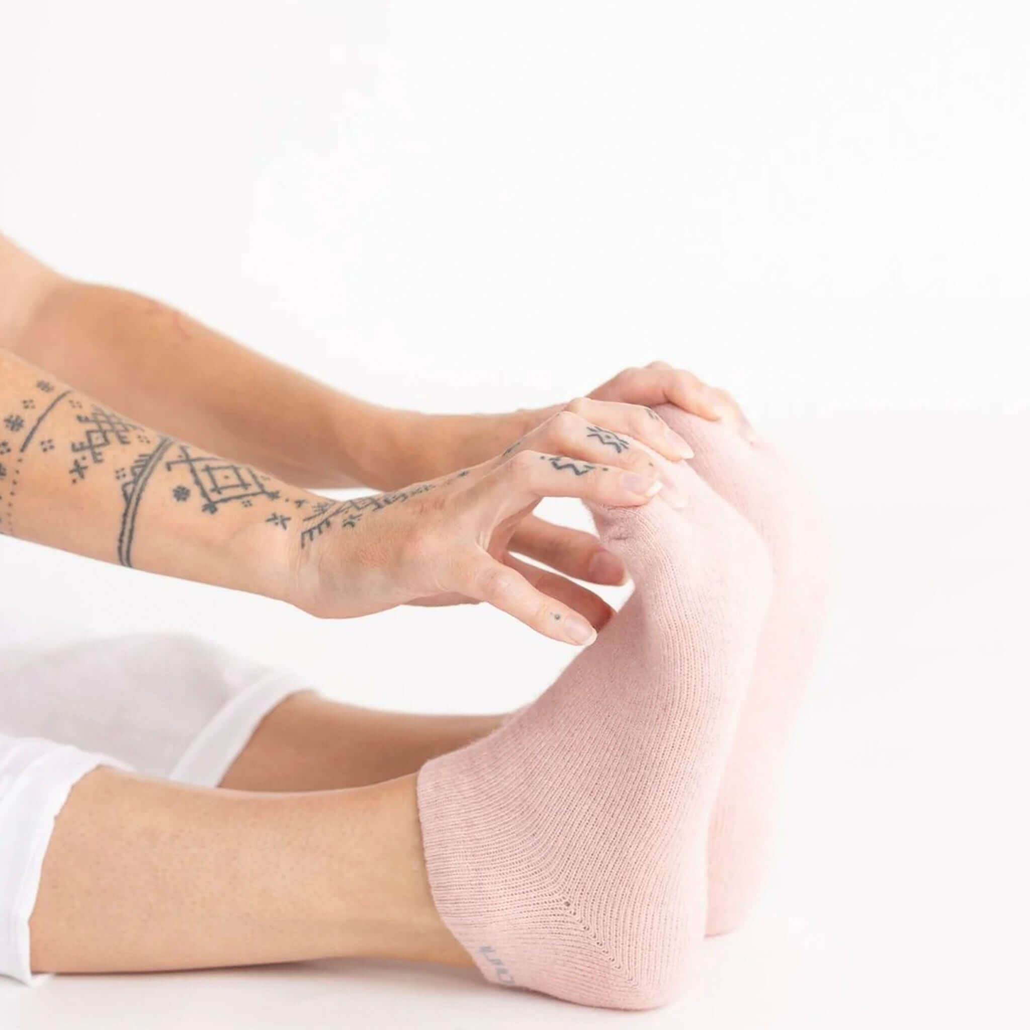 Nooan Napier Possum Merino Hamilton Socks - Rosewater being worn, showcasing comfort and style.