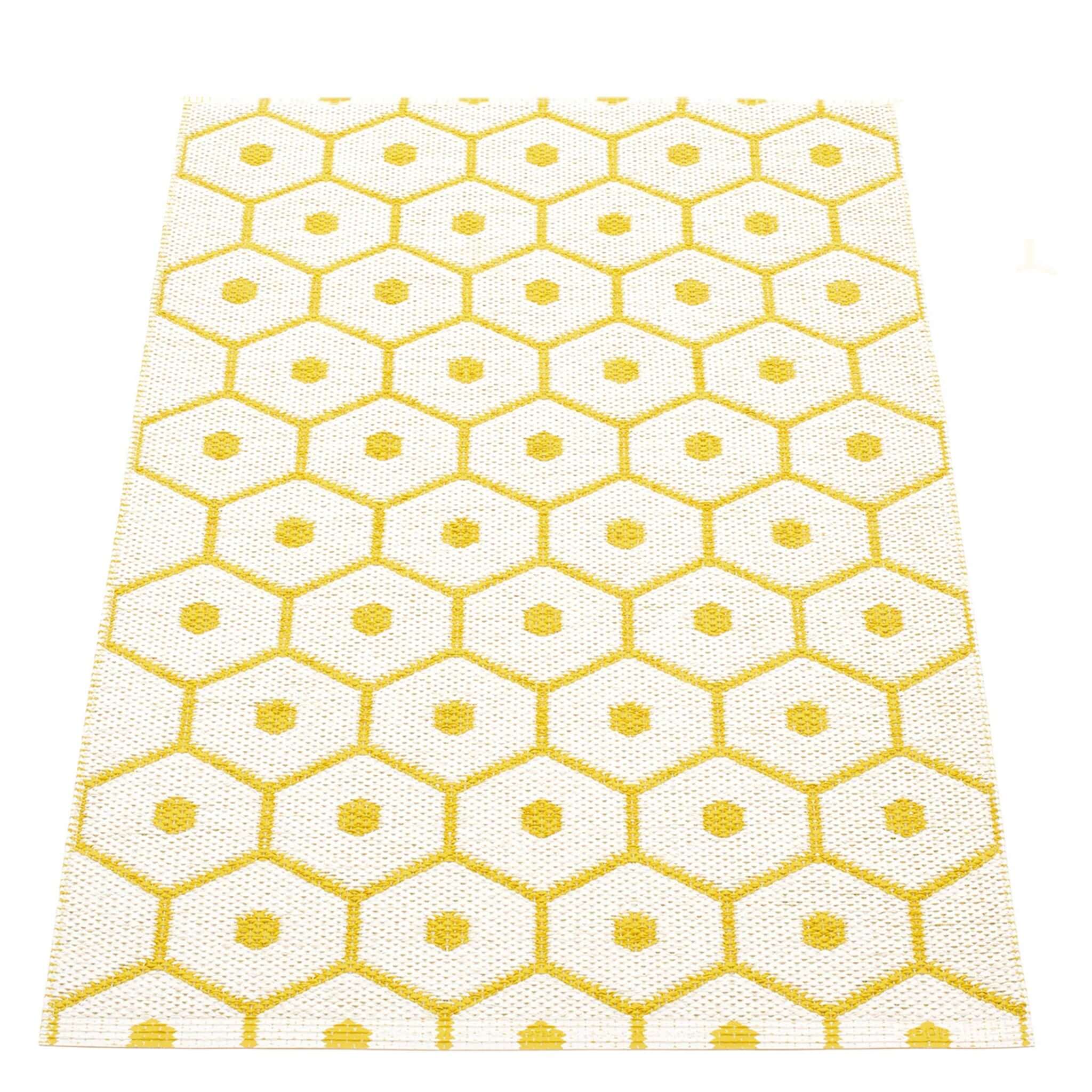 Pappelina Sweden Honey Reversible Mat - Mustard & Vanilla featuring a honeycomb pattern in vibrant yellow.