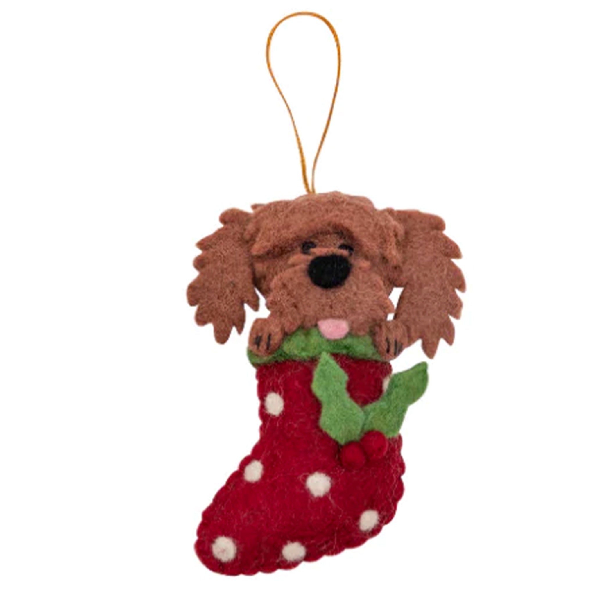 Brown felt dog ornament in a red stocking with holly leaves on a white background