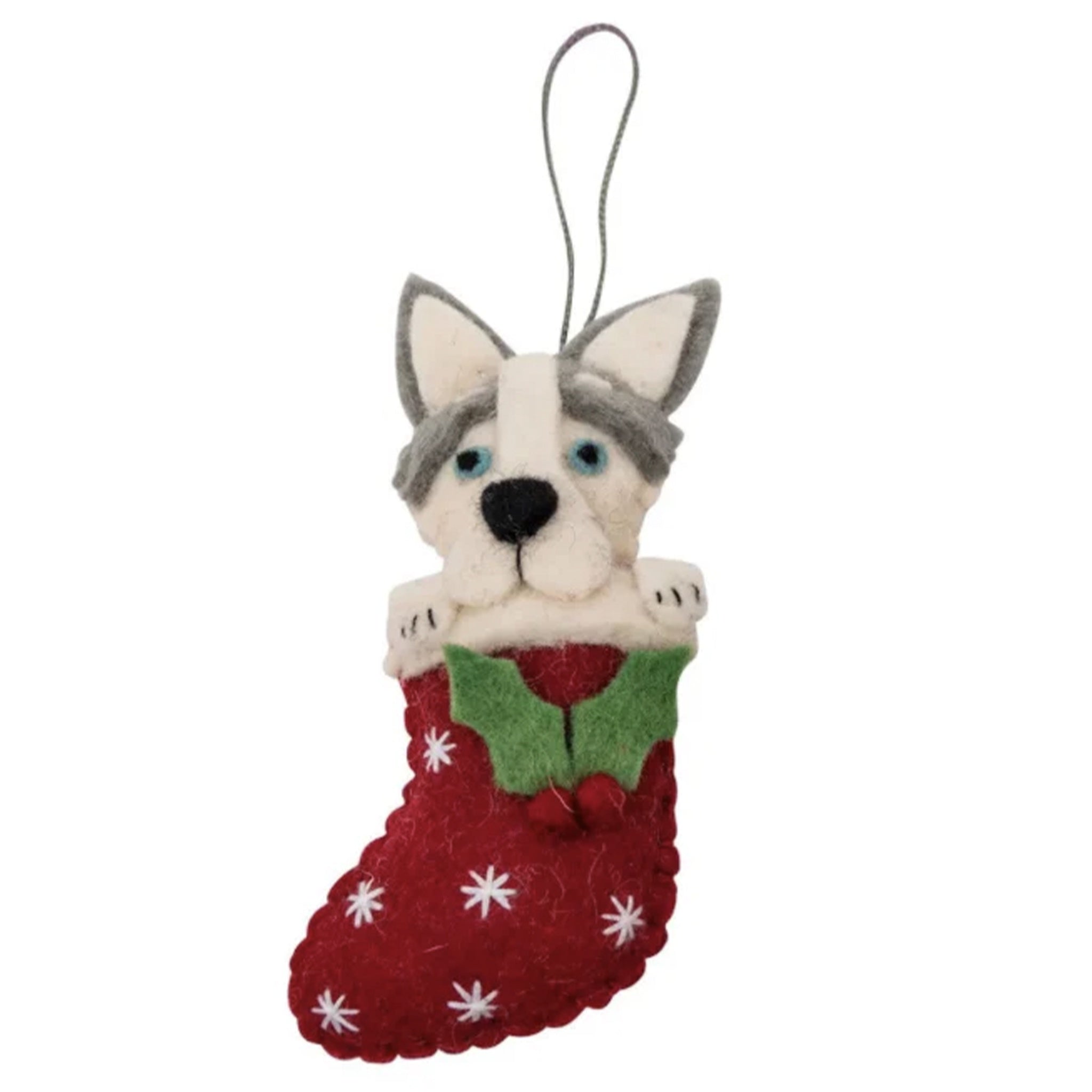 Felt husky dog ornament in a red stocking on a white background