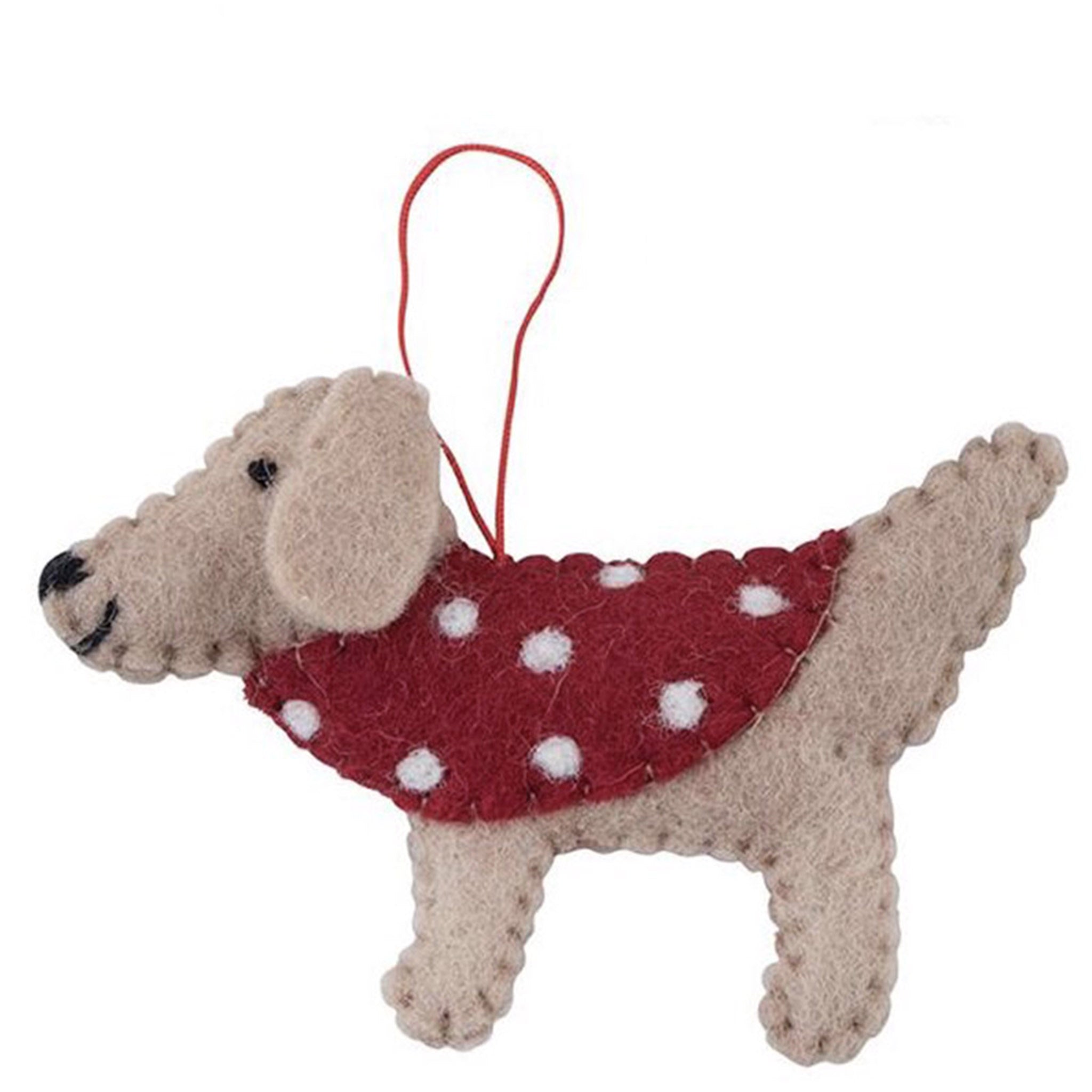 Dog-shaped ornament wearing a red sweater with white polka dots on a white background