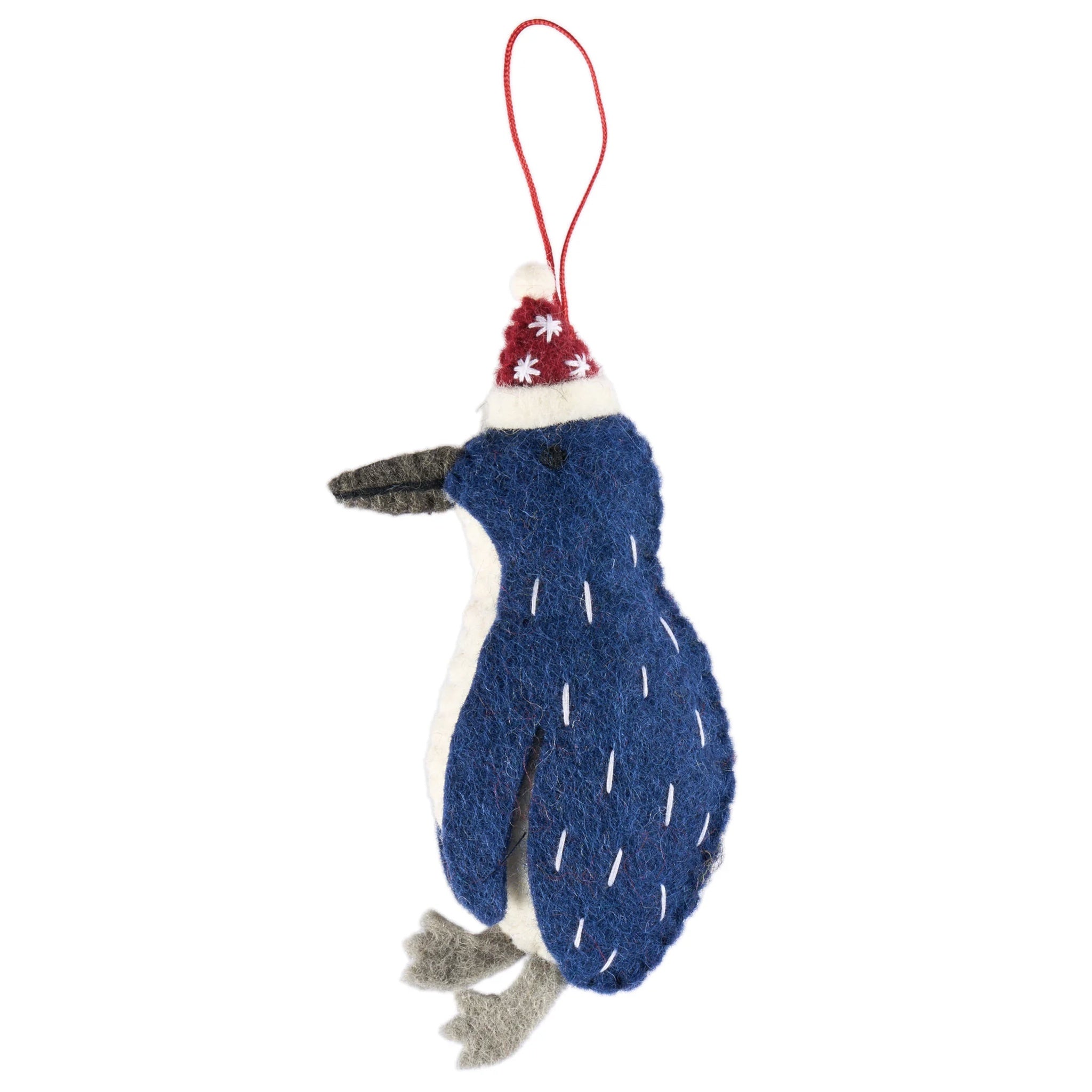 Blue penguin ornament with a red and white hat on a white background