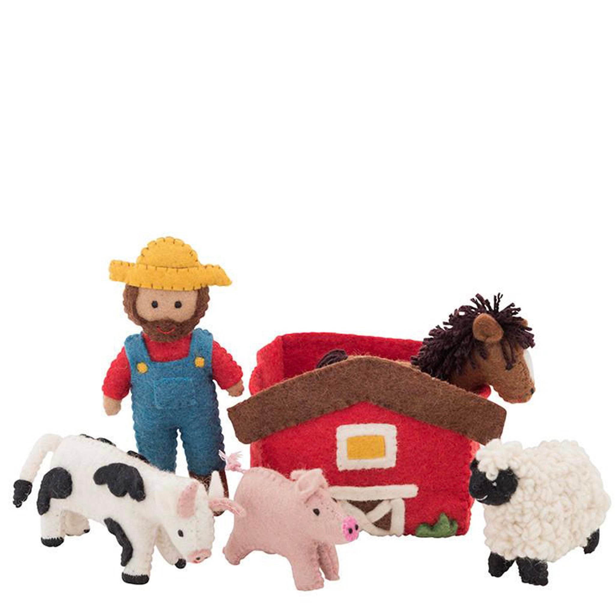 Set of toy farm animals and a barn with a farmer figure on a white background