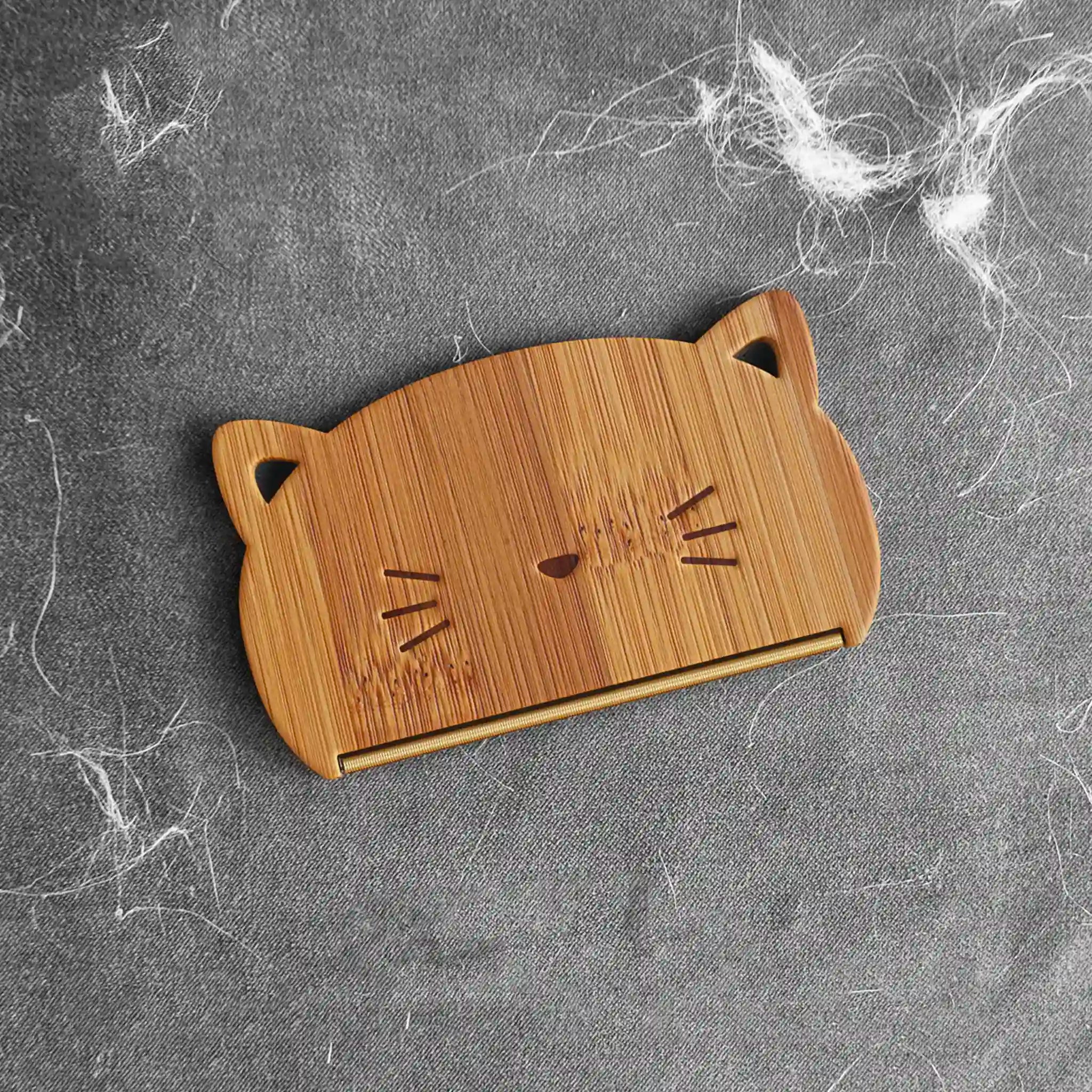 Wooden cat-shaped cutting board on a textured gray surface