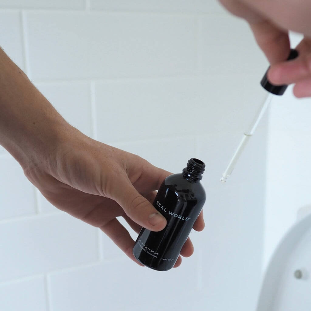 Alt Tag: Real World NZ Revive Toilet Drops 200ml Refill - Koromiko Leaf & Lemongrass refill pouch poured into bottle for fresh bathroom deodorising