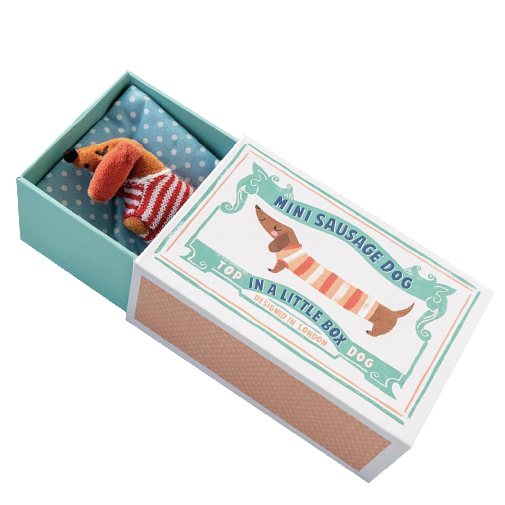Miniature plush dog toy in a decorative box with text