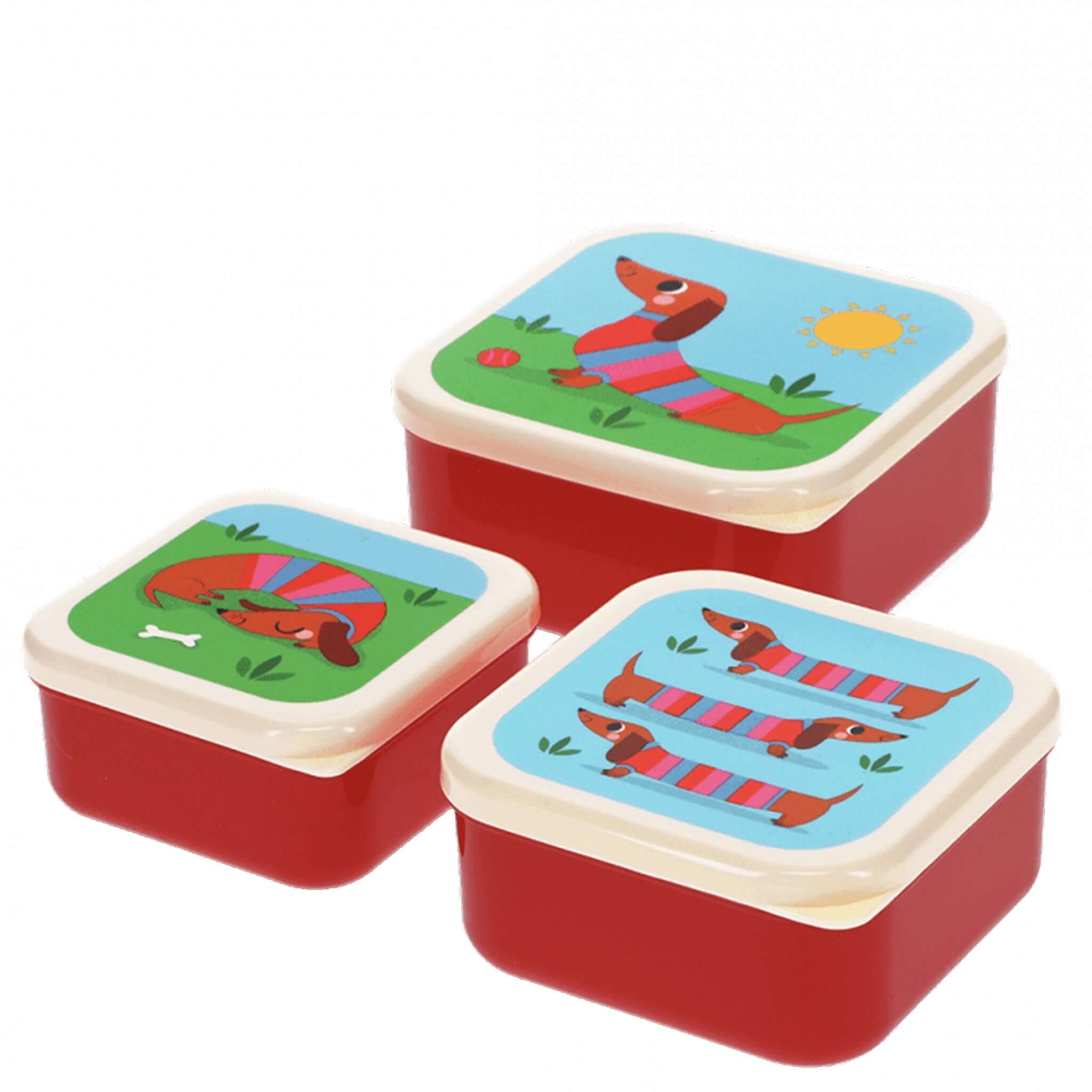 Set of three red food containers with sausage dog designs on a white background