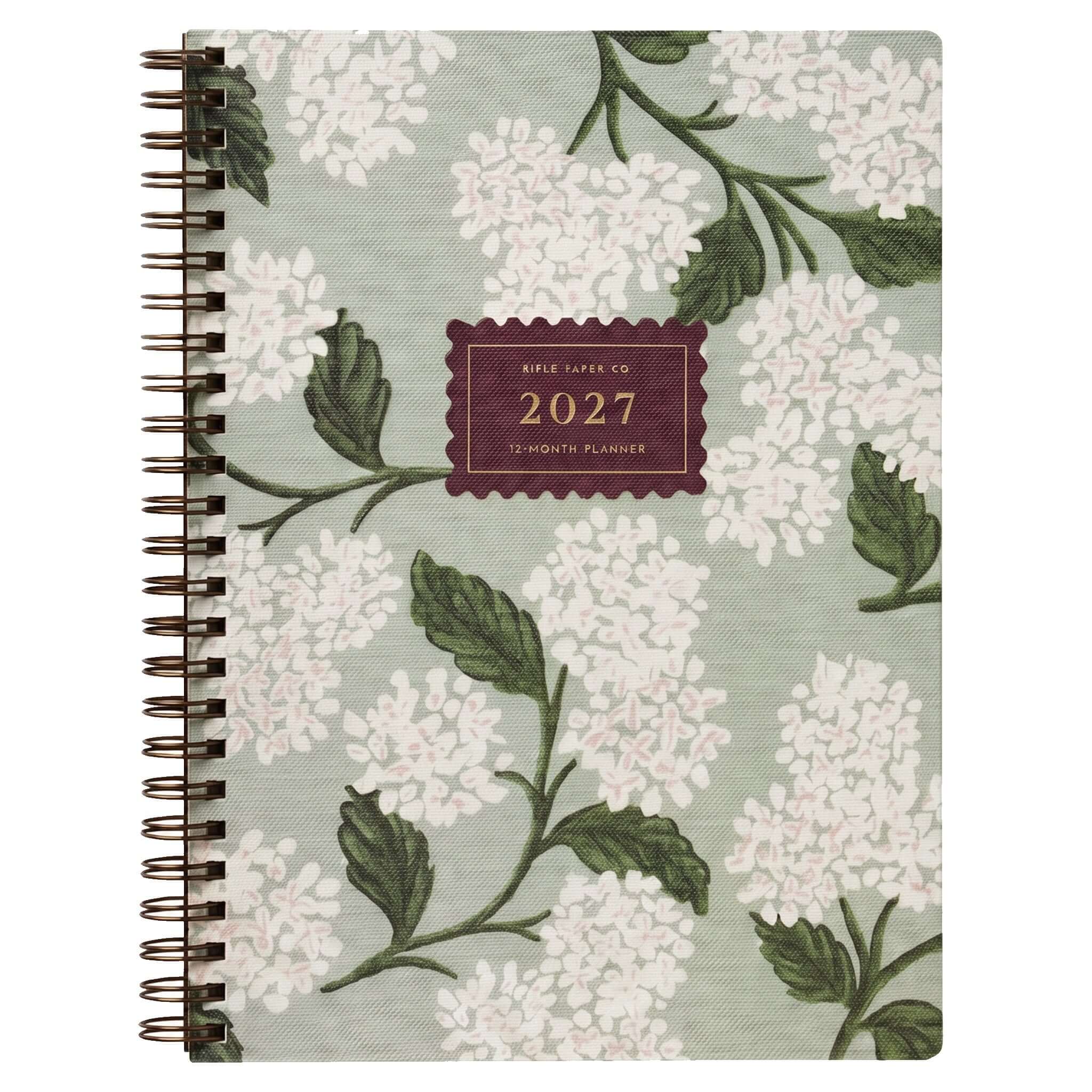 Rifle Paper 2027 Weekly Softcover Spiral Planner - Sage Hydrangea with white hydrangea design on sage green cover.
