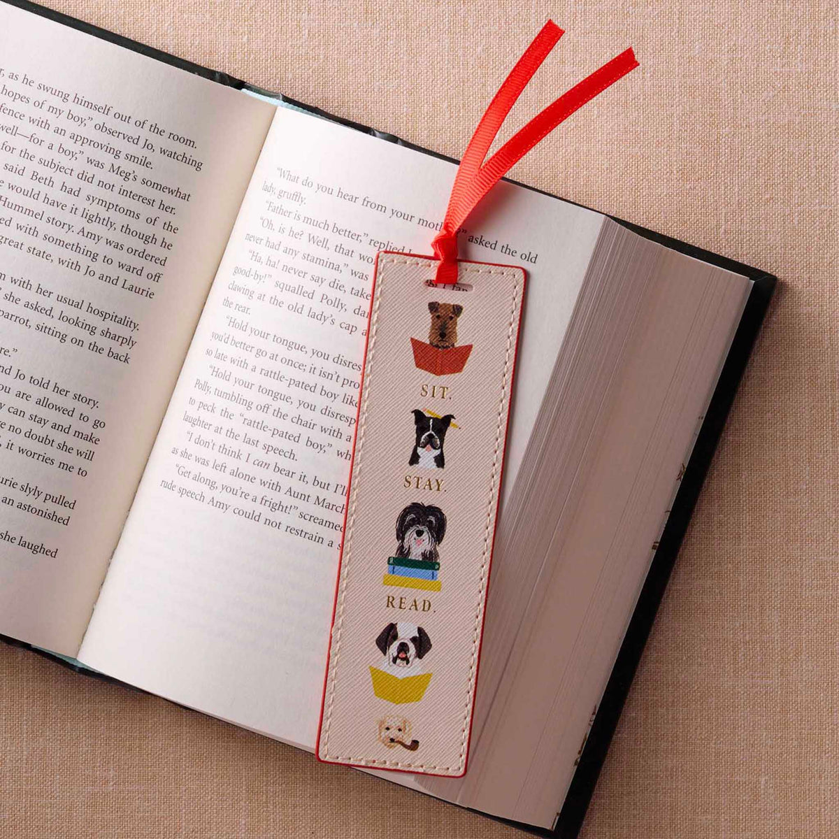 Rifle Paper Bookmark - Studious Dogs featuring playful dog illustrations and 'Sit Stay Read' on a book.