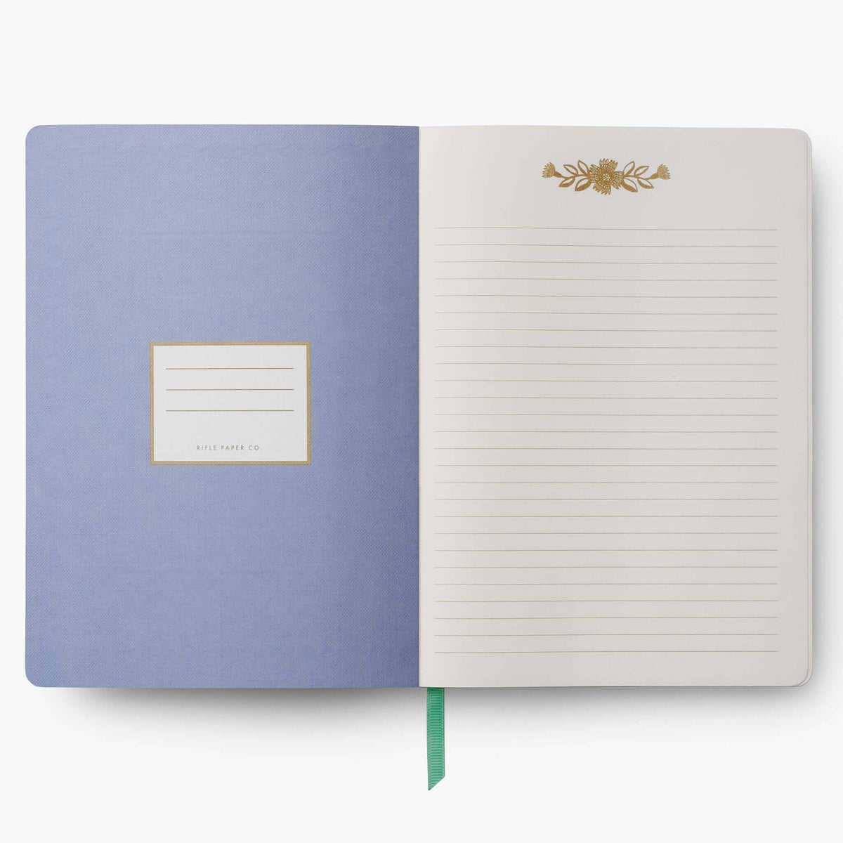 Inside view of the Rifle Paper Softcover Journal - Aster with lined pages and gold detailing.