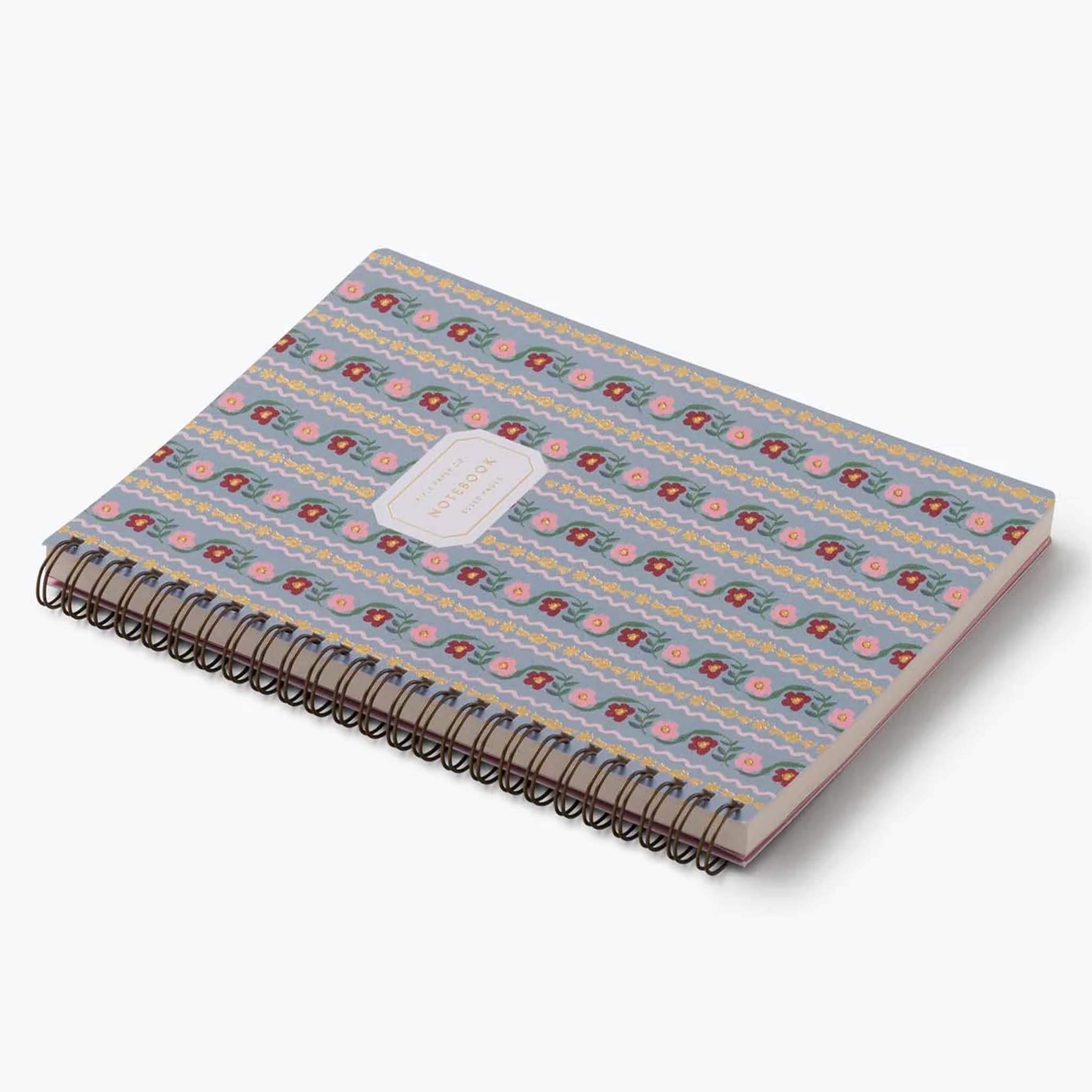 Rifle Paper Spiral Notebook - Delphine with floral stripes in pink and blue, featuring gold foil accents.