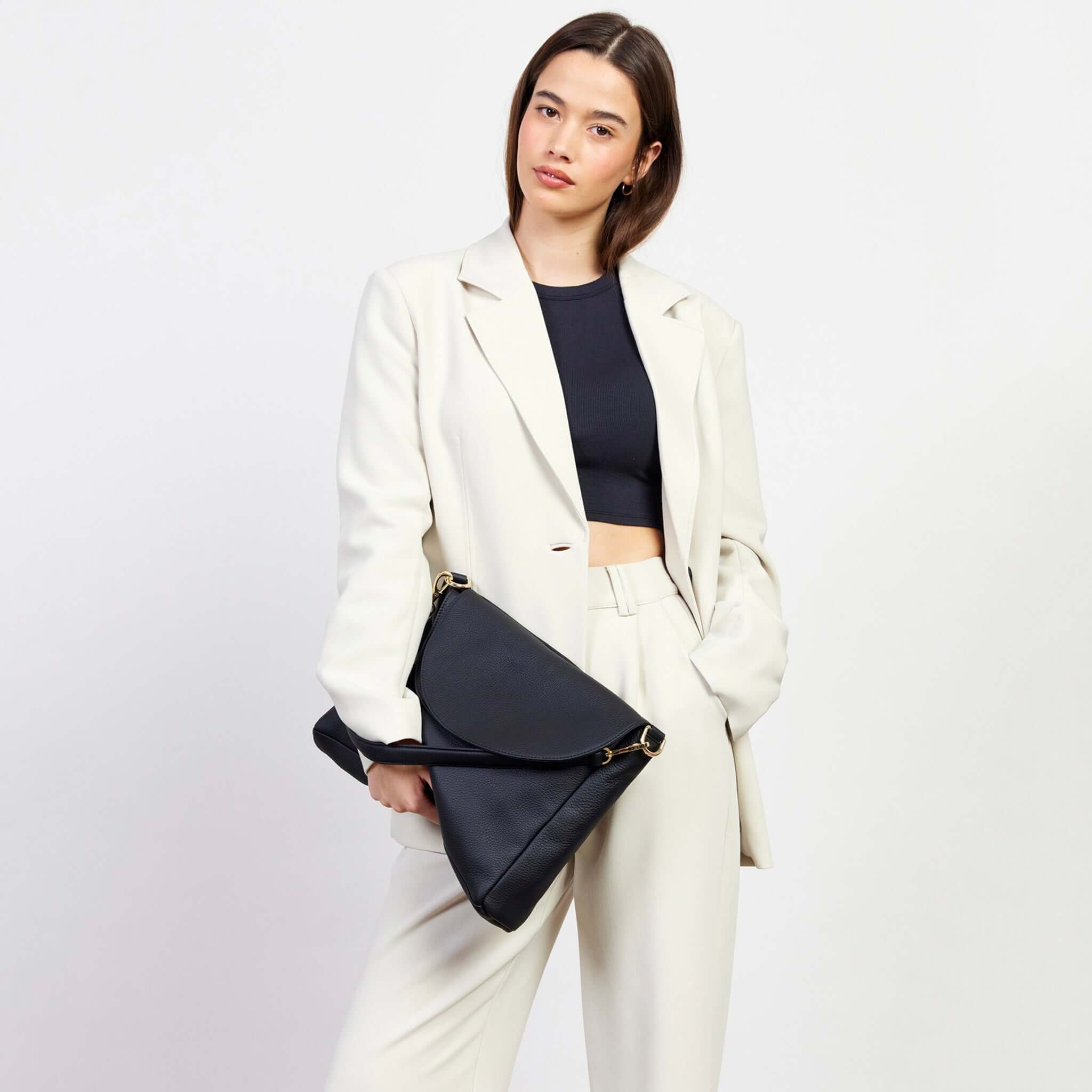 Alt Tag: Saben Becks Shoulder Bag - Black Luxe in soft black leather, foldover draped silhouette, worn crossbody by model