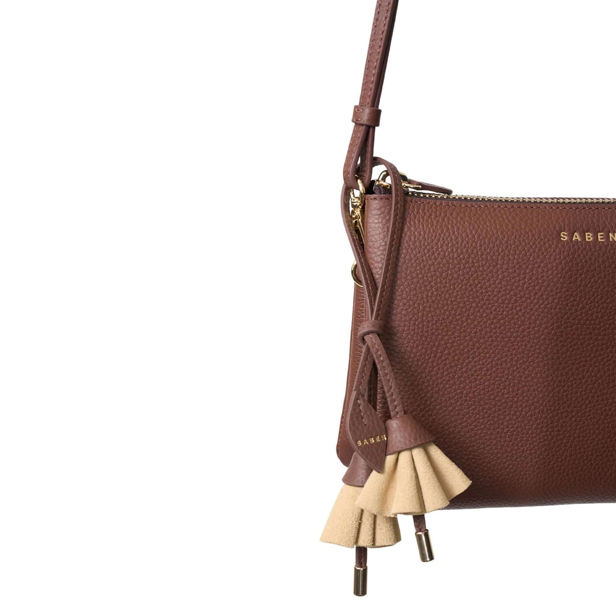 Saben Charm Lacing Bloom - Raffia tassel key charm on brown Saben leather bag, desert bloom-inspired accessory detail