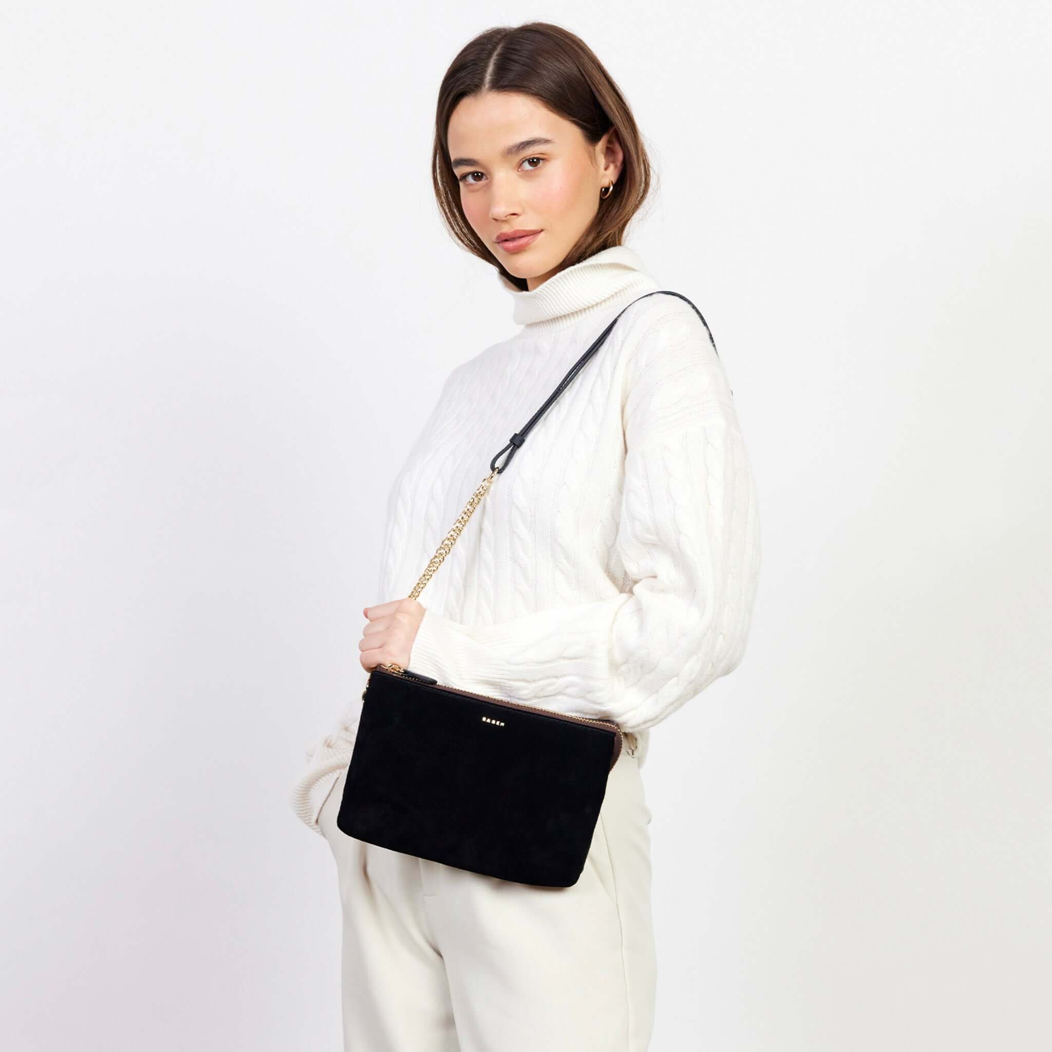 Alt Tag: Saben Feature Chain Strap - Gold Curb with Black Leather on black crossbody bag, adjustable detachable gold curb chain with leather