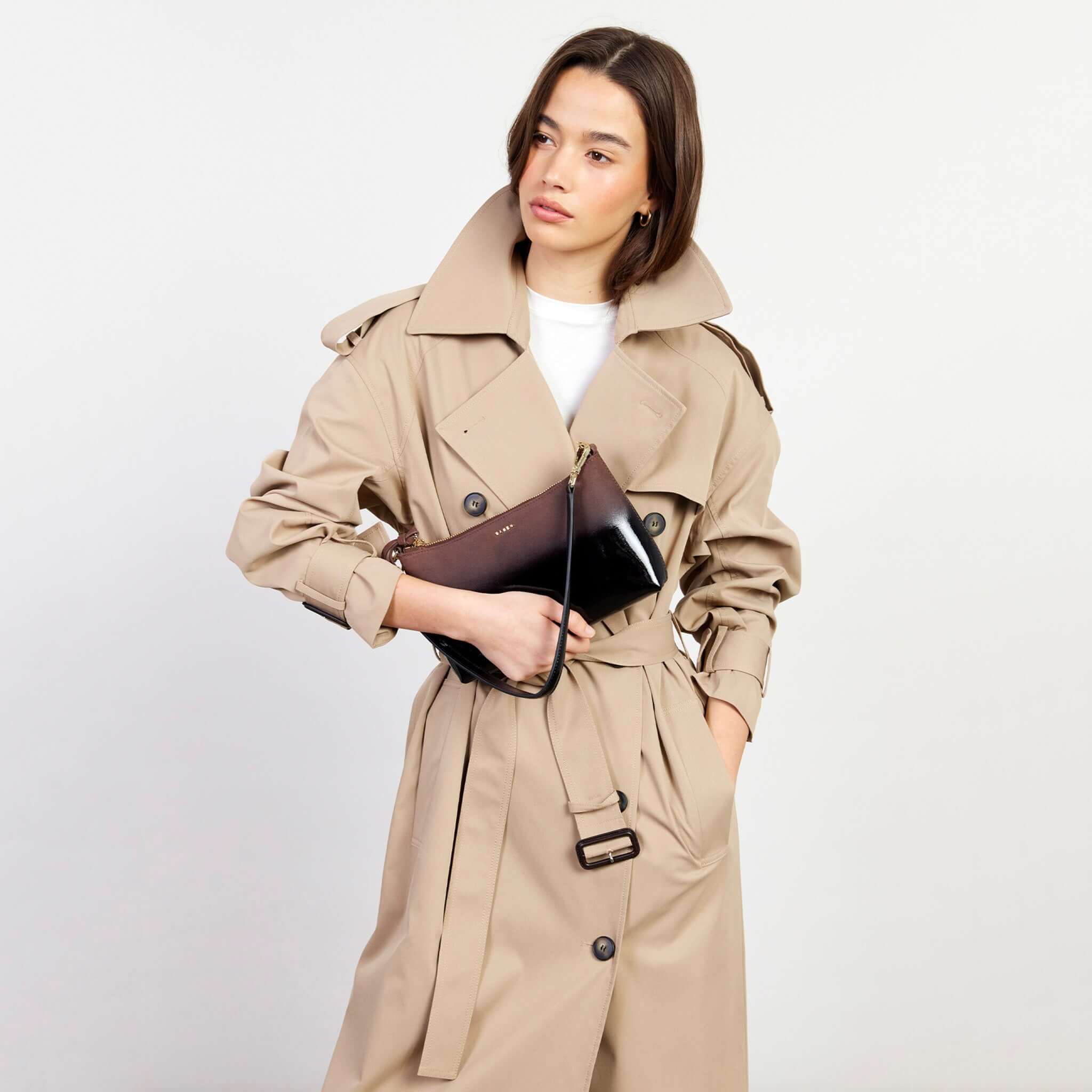 Alt Tag: Model holding Saben Haven Shoulder Bag - Espresso Dipped with shoulder strap, compact leather bag for nights out and brunch