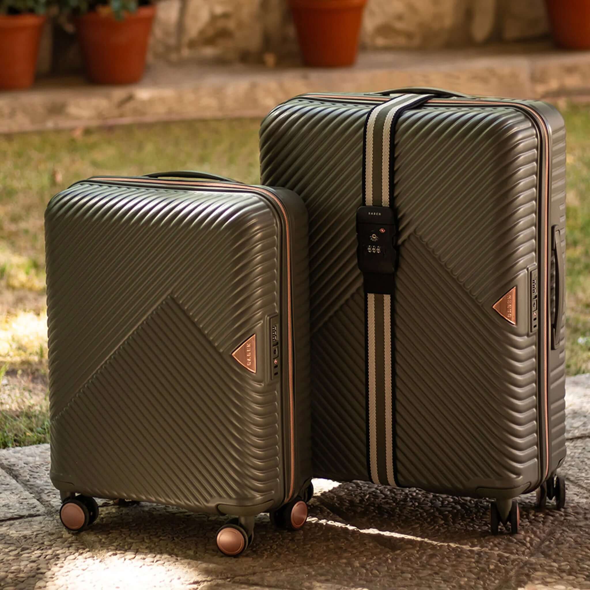 Alt Tag: Saben London Luggage Strap - Black Stripe on suitcase with adjustable TSA-compatible three-number lock for secure travel