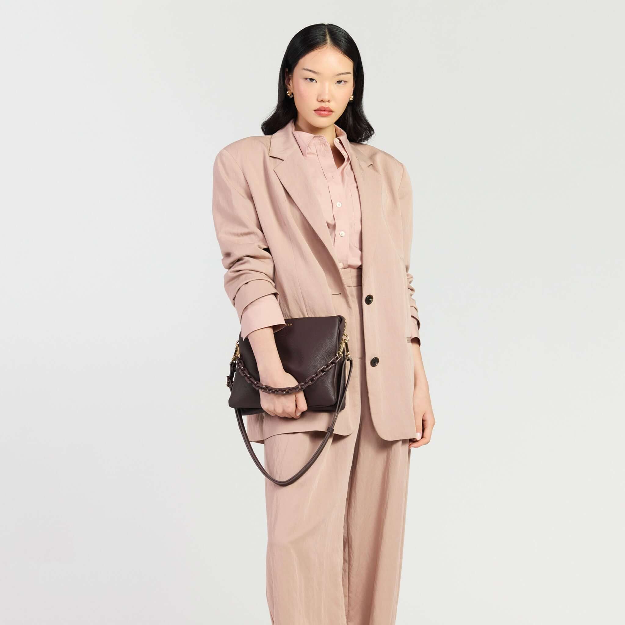 Model showcasing Saben Matilda Crossbody Bag - Cocao with Tonal Chain styled with elegant attire.