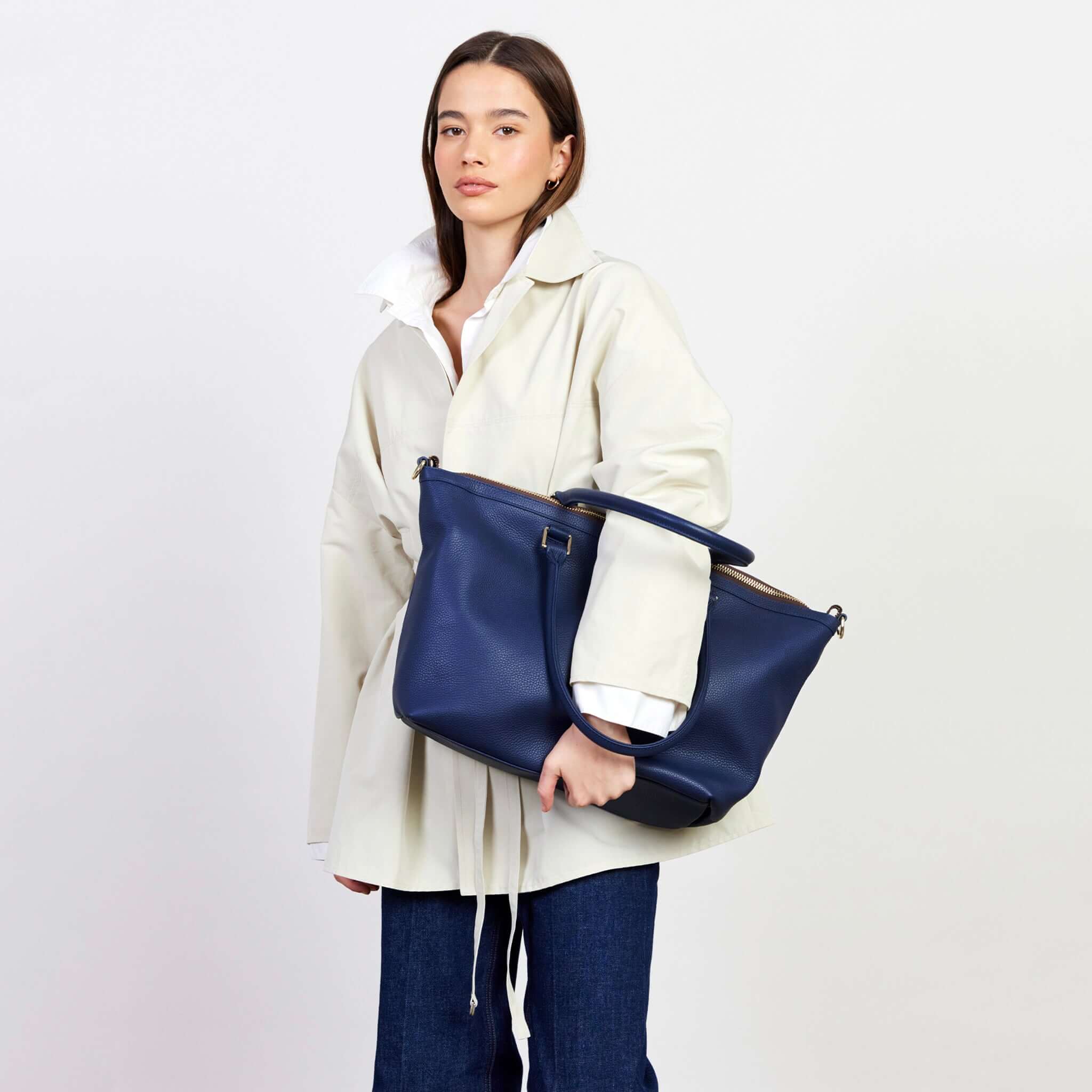 Saben Milan Carry-All Bag - Ink carried by model in stylish outfit, showcasing its spacious design and versatile use.
