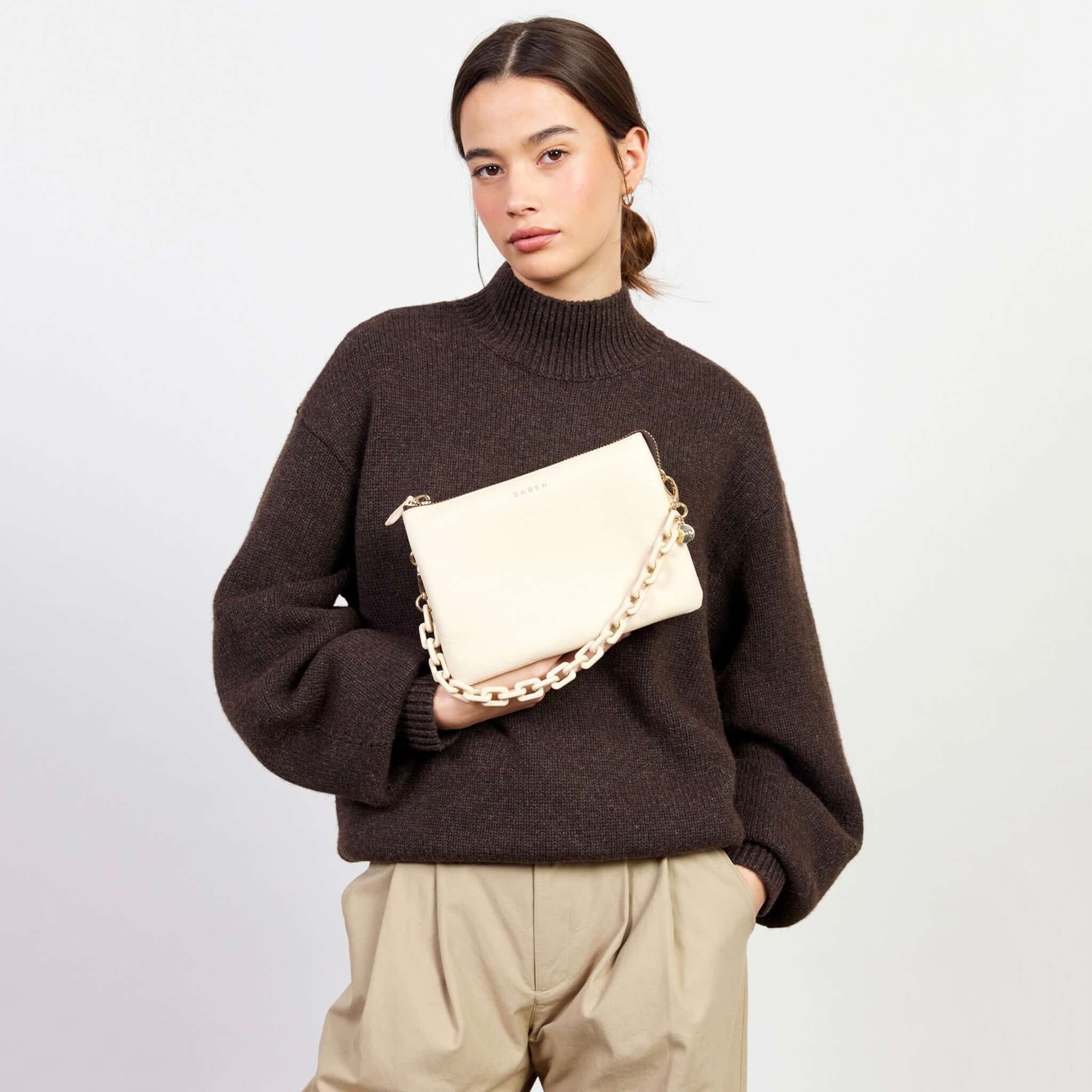 Alt Tag: Saben Tilly's Big Sis Crossbody Bag - Vanilla in pebbled vanilla leather, worn as a chic crossbody with chain strap