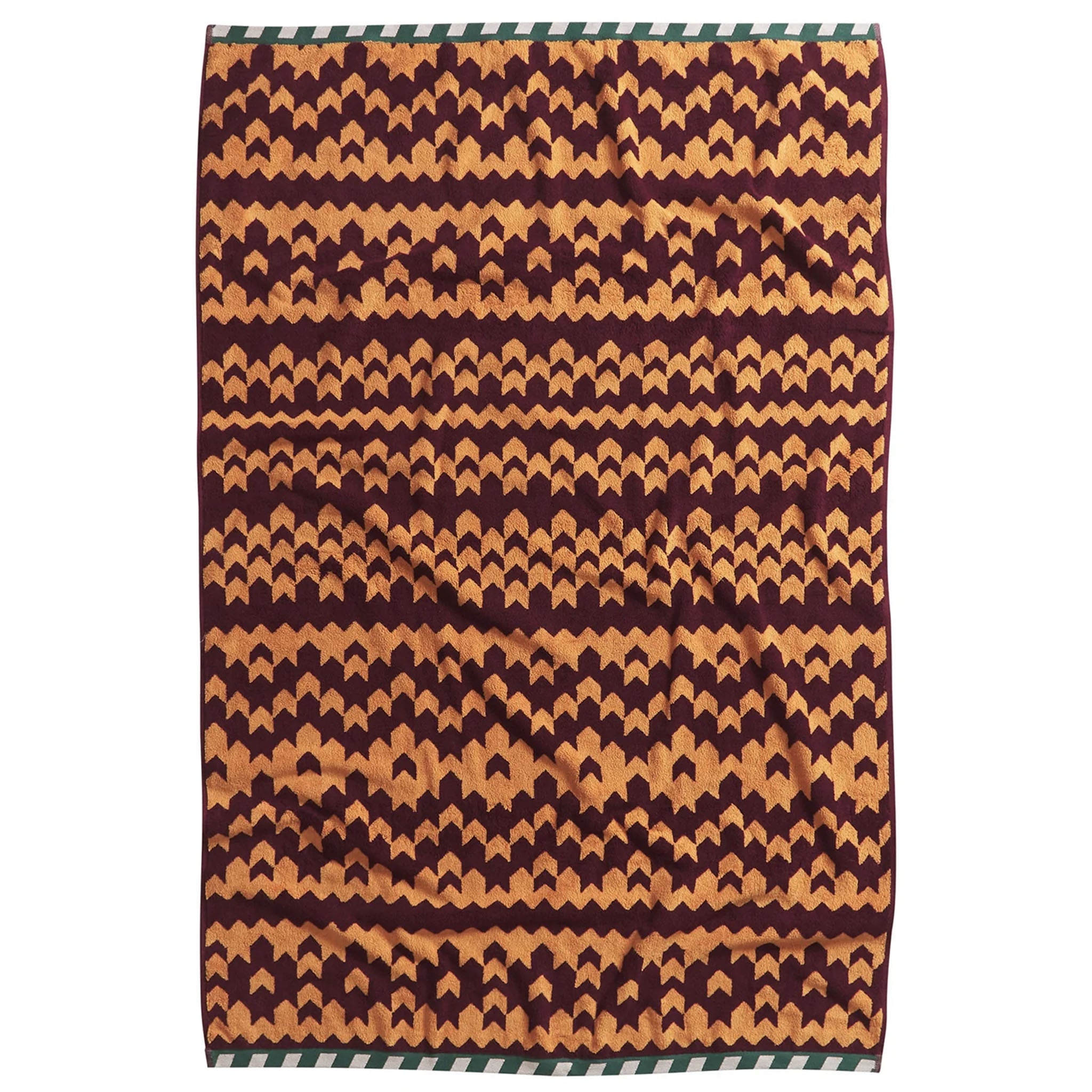 A bath sheet with a geometric pattern in beige and brown colors, featuring a zigzag design.
