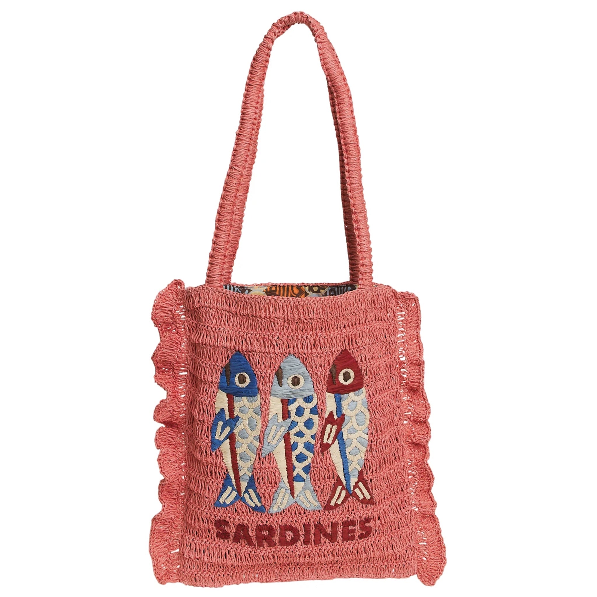 Pink woven bag with fish design and 'Sardines' text on a white background