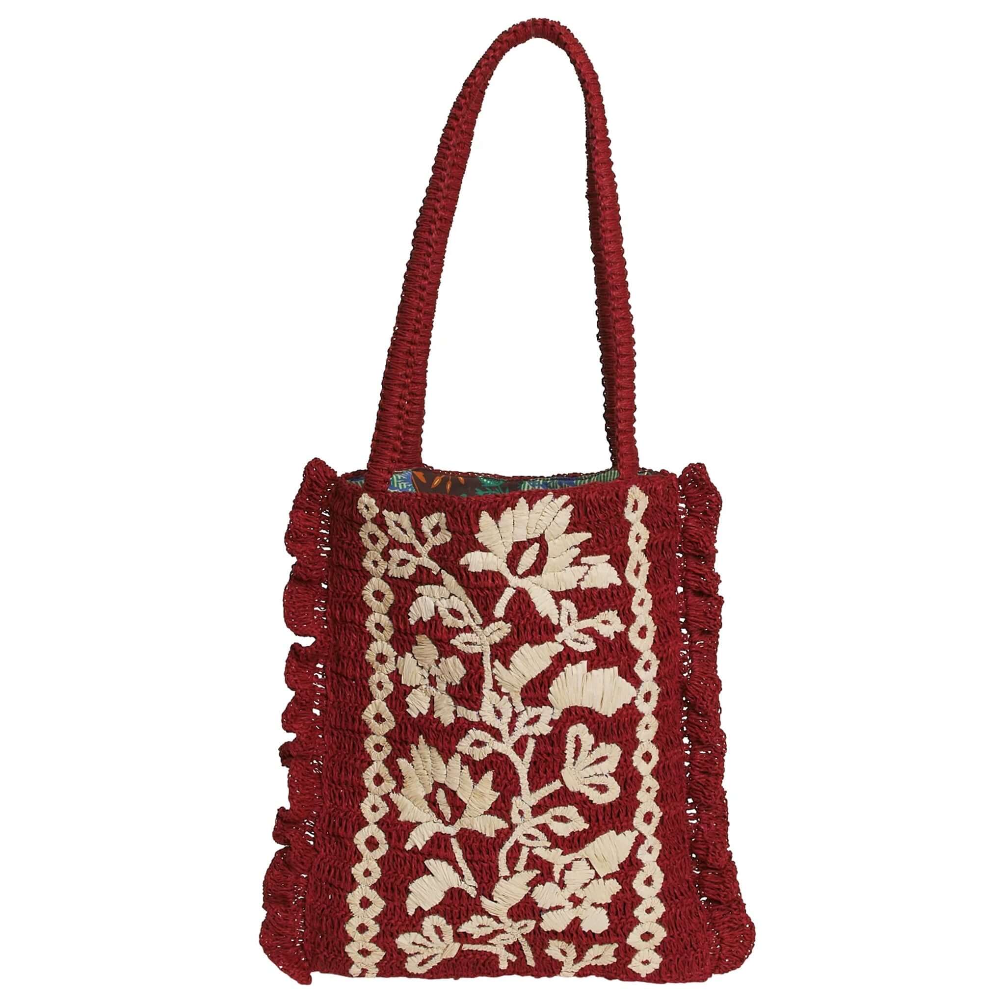 Red handbag with floral embroidery on a white background